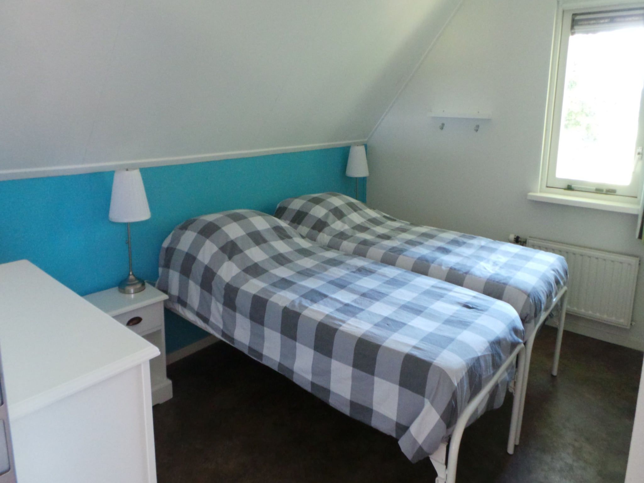 Een slaapkamer van Buitenplaats Berg en Bos nummer 15 in Lemele