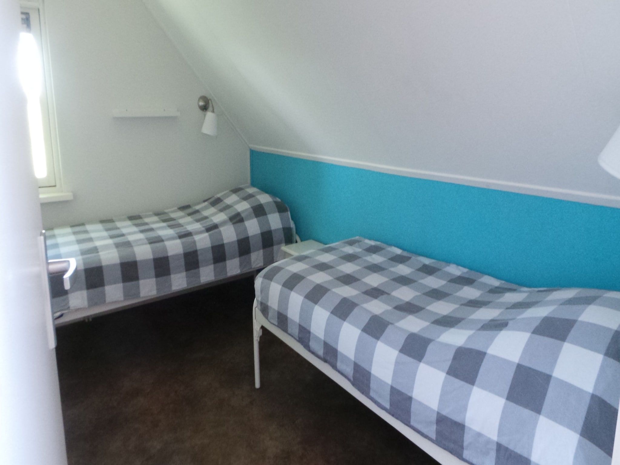 Een slaapkamer van Buitenplaats Berg en Bos nummer 15 in Lemele