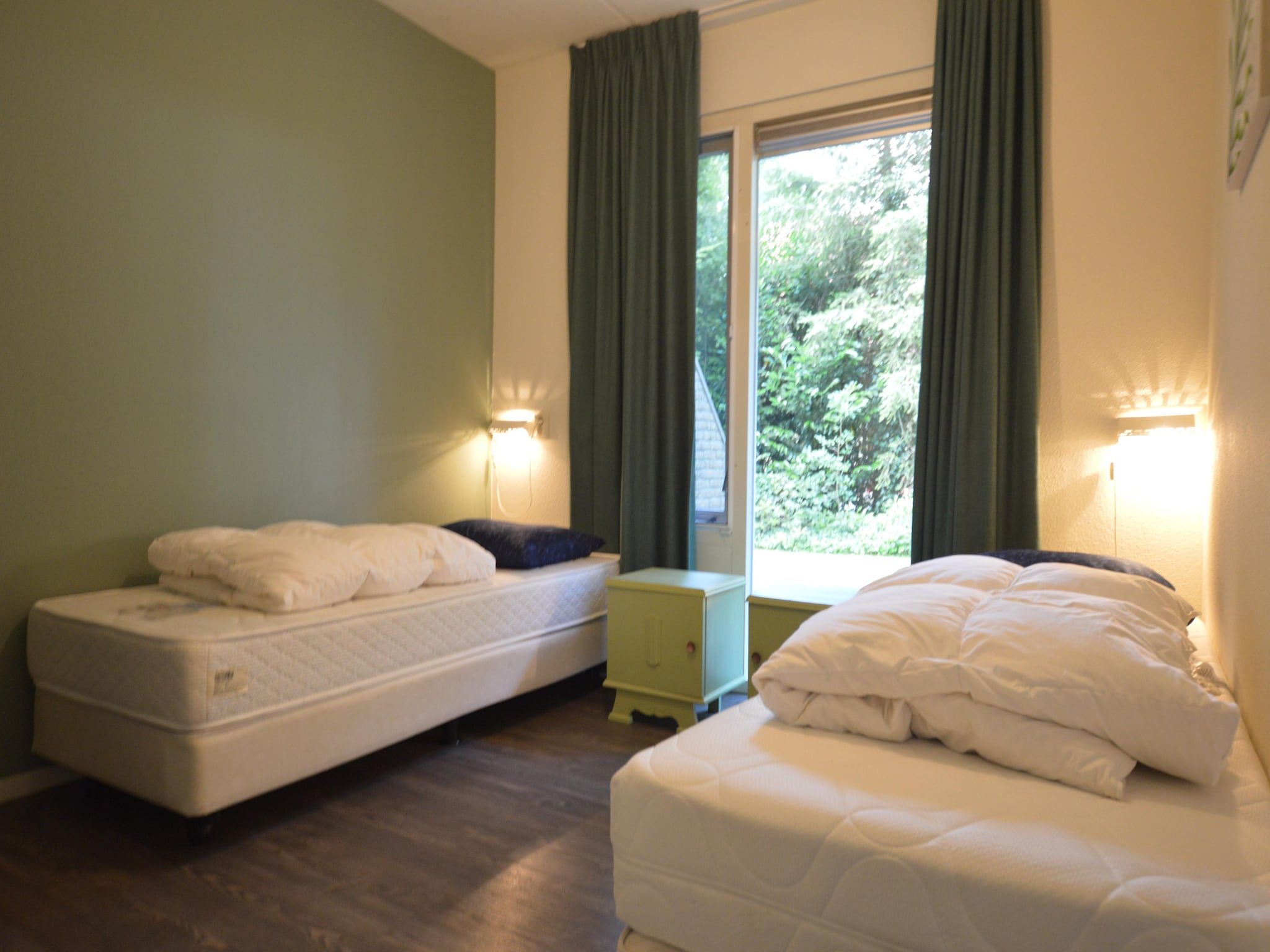 Een slaapkamer van Buitenplaats Berg en Bos nummer 13 in Overijssel