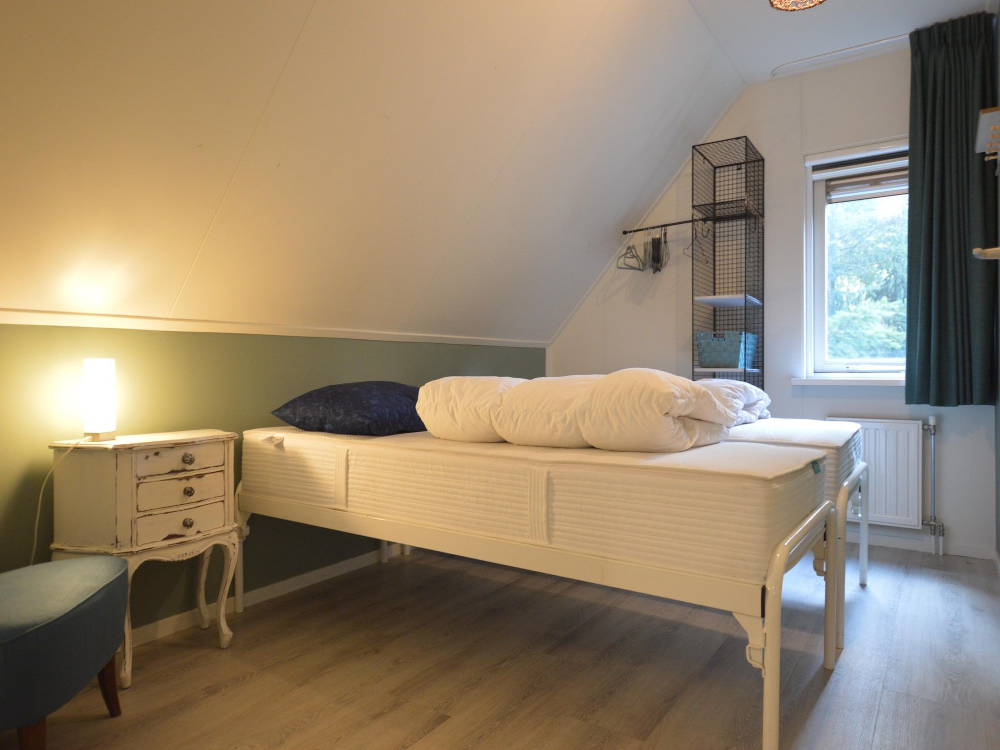 Een slaapkamer van Buitenplaats Berg en Bos nummer 13 in Overijssel