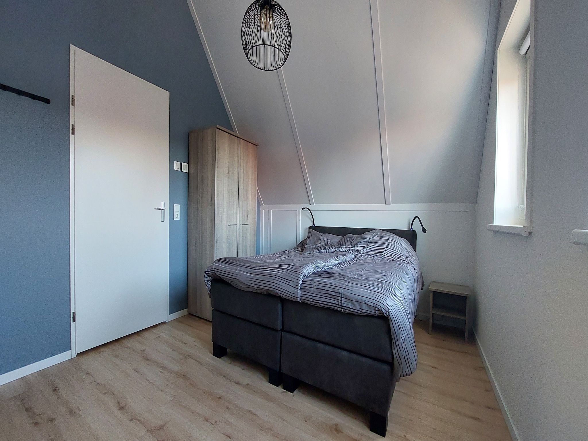 Een slaapkamer van De Meerkoet Huis Nr 37 in Scherpenisse