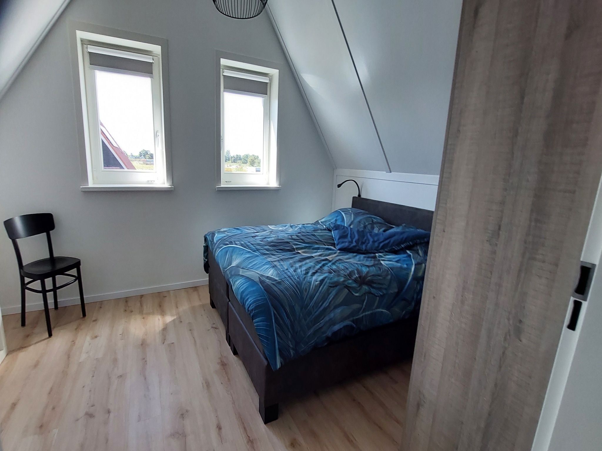 Een slaapkamer van De Meerkoet Huis Nr 37 in Scherpenisse