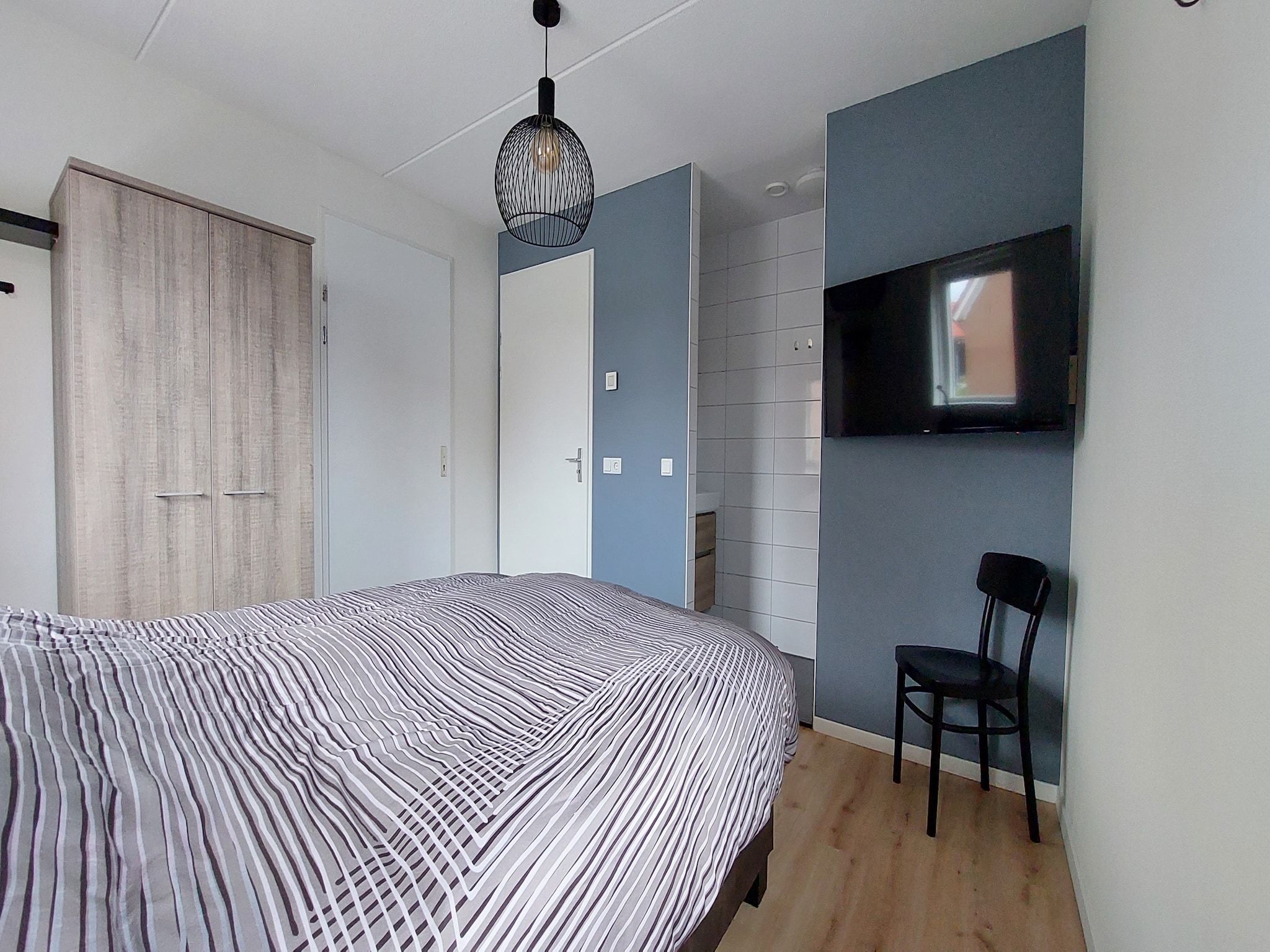 Een slaapkamer van De Meerkoet Huis Nr 37 in Scherpenisse