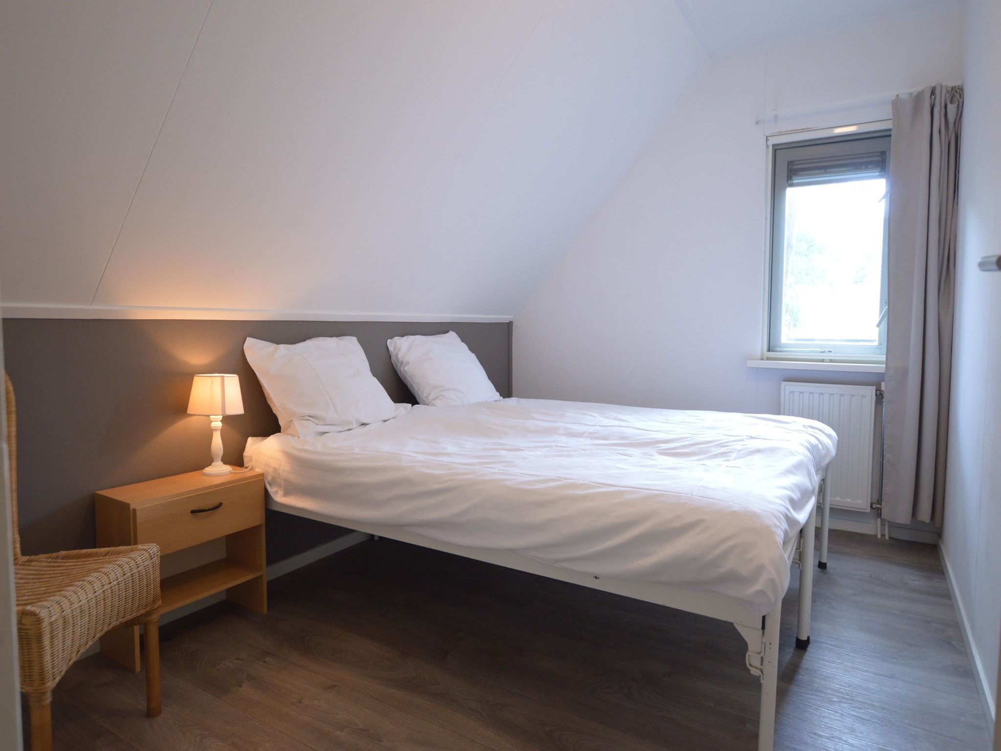 Een slaapkamer van Buitenplaats Berg en Bos nummer 4 in Lemele