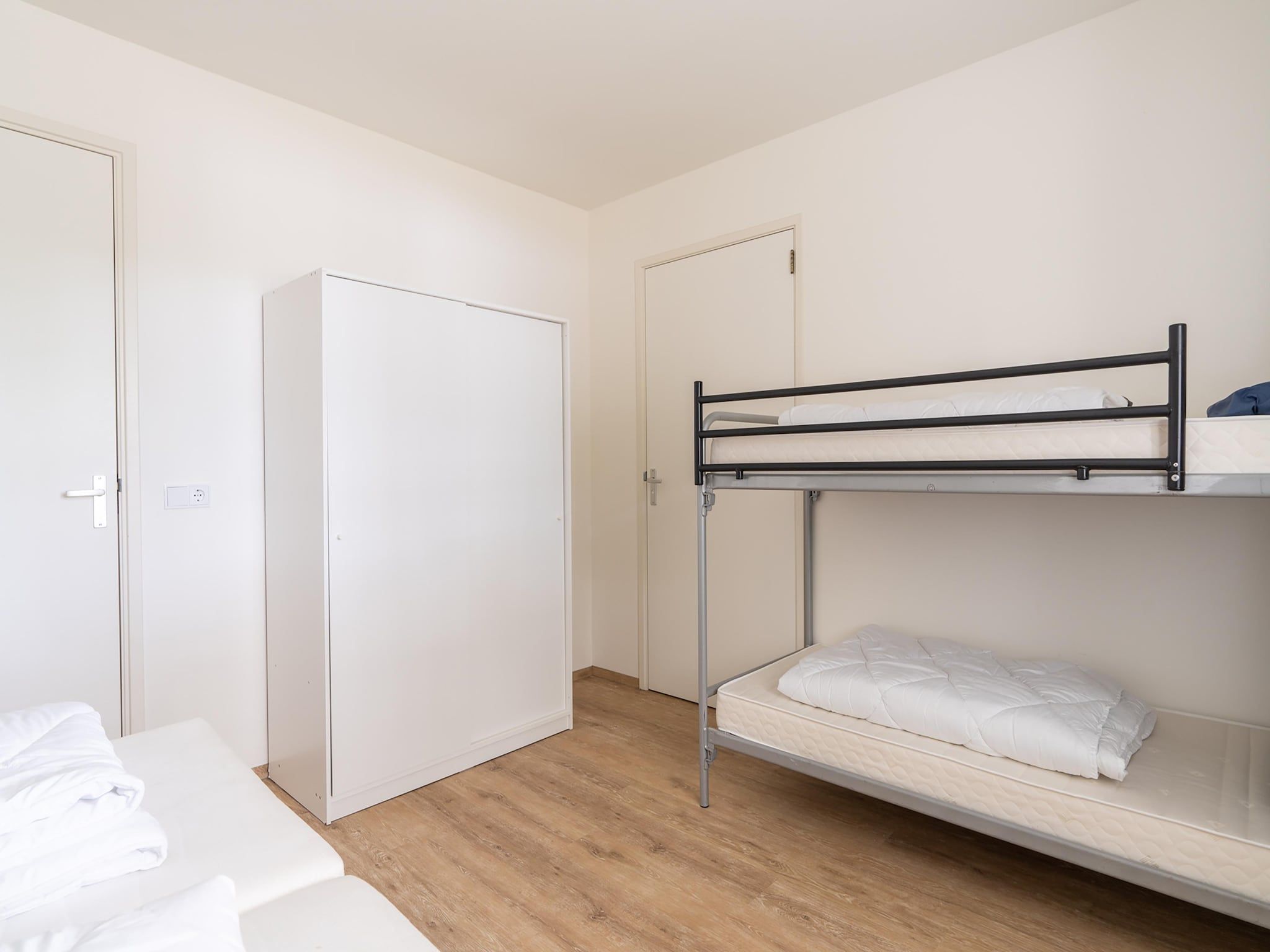 Een slaapkamer van Vrijersduin in Nes