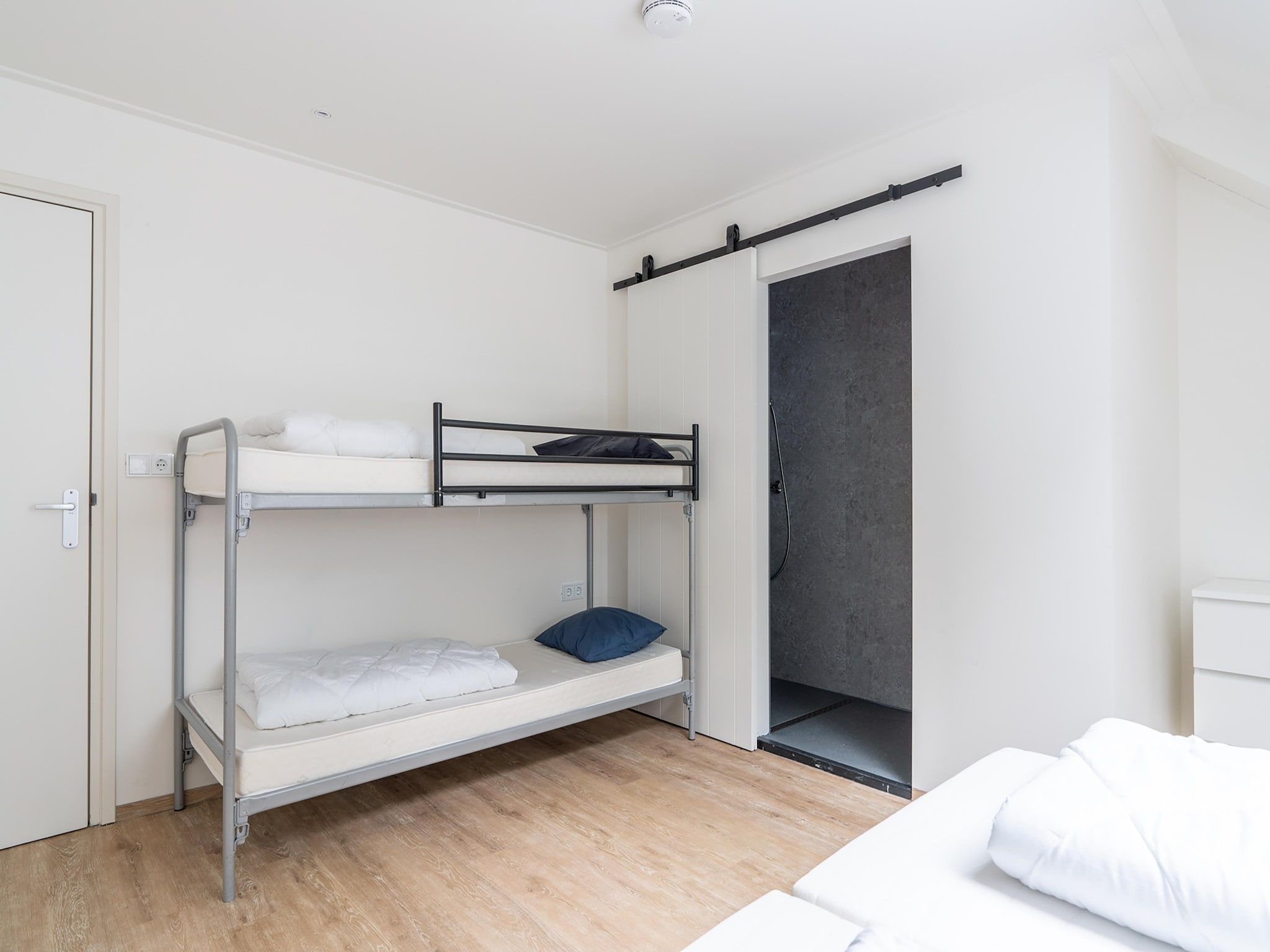 Een slaapkamer van Vrijersduin in Nes