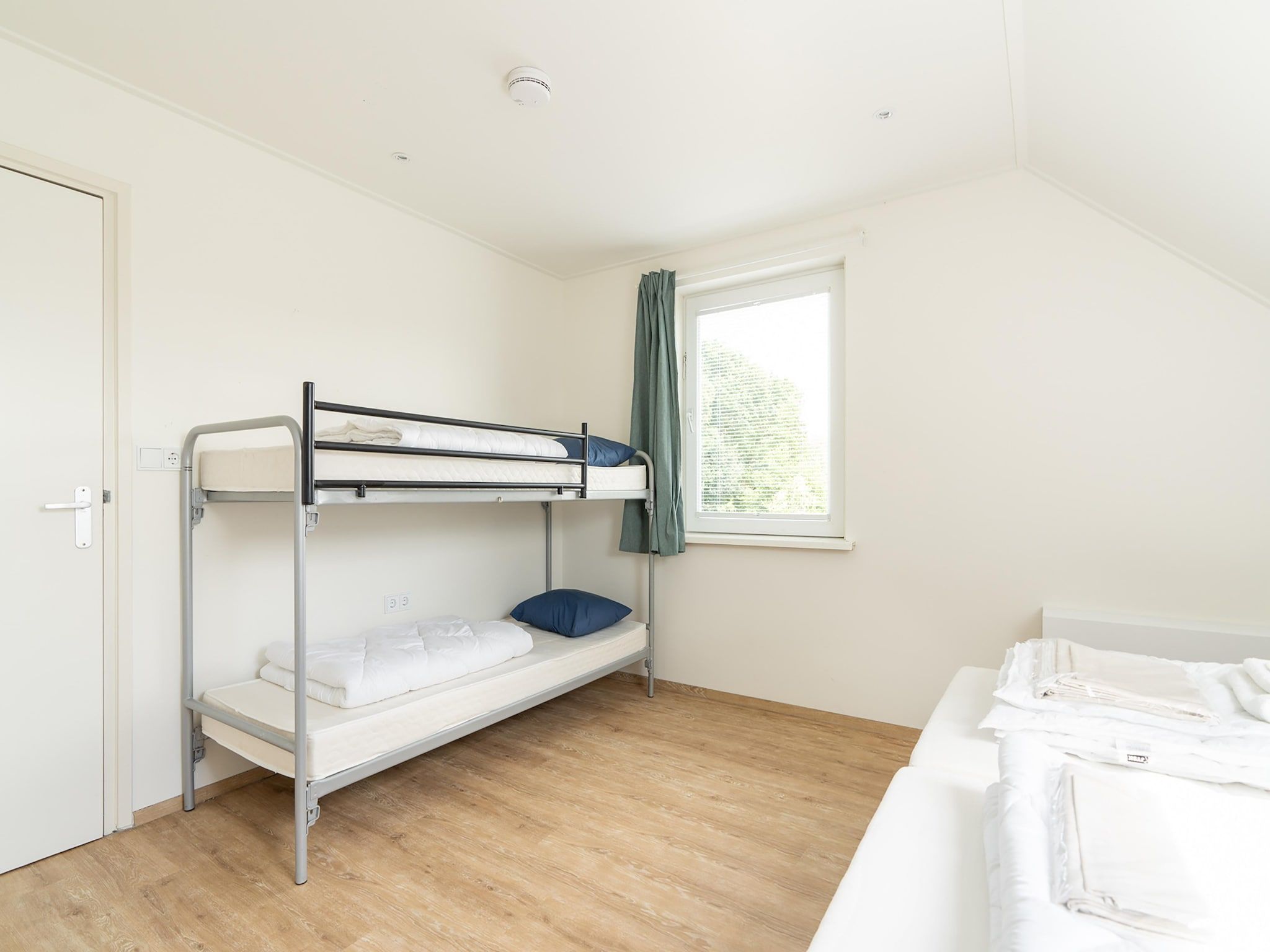 Een slaapkamer van Kaapsduin in Nes