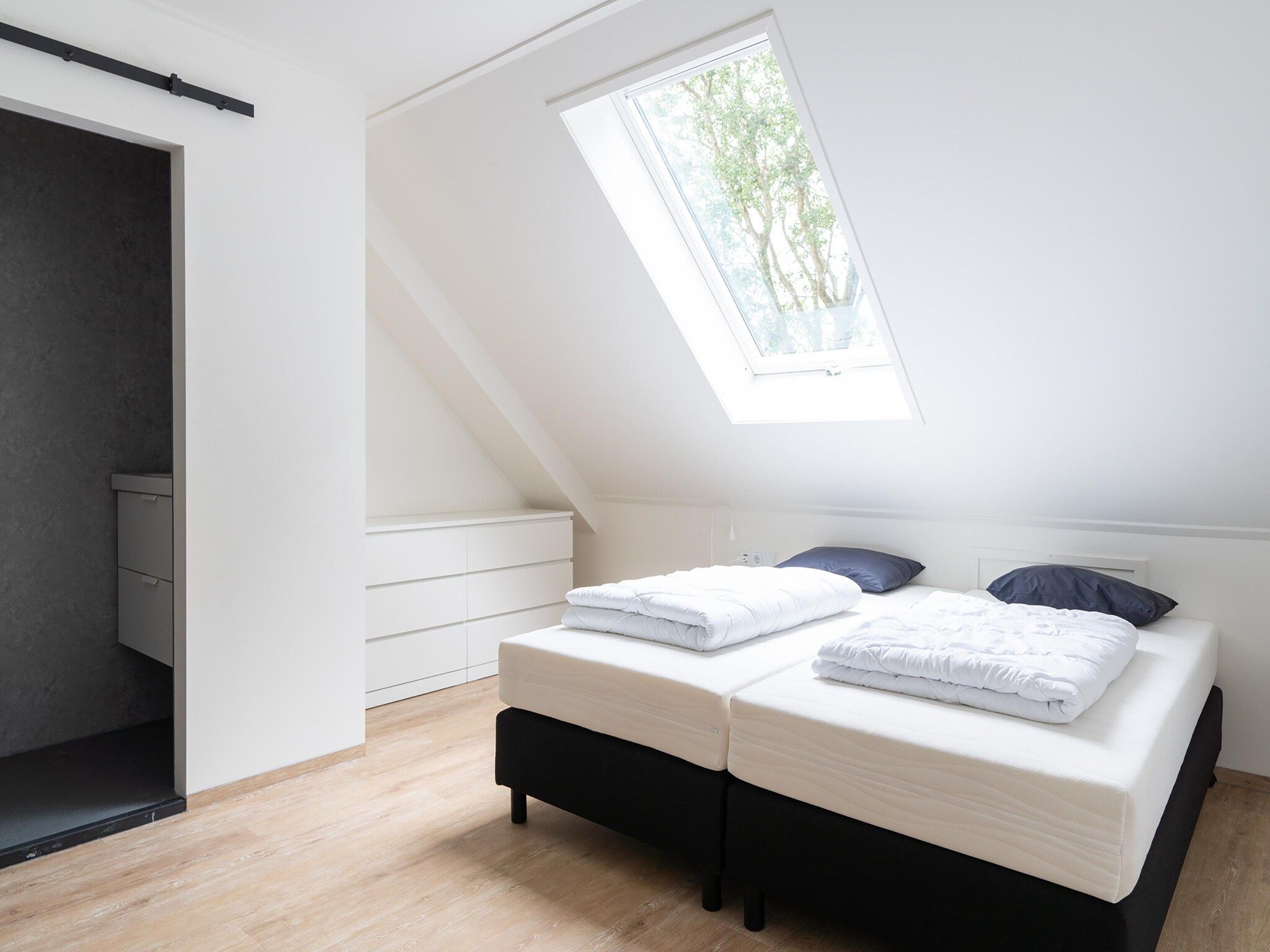 Een slaapkamer van Combi Vrijersduin en Kaapsduin in Nes