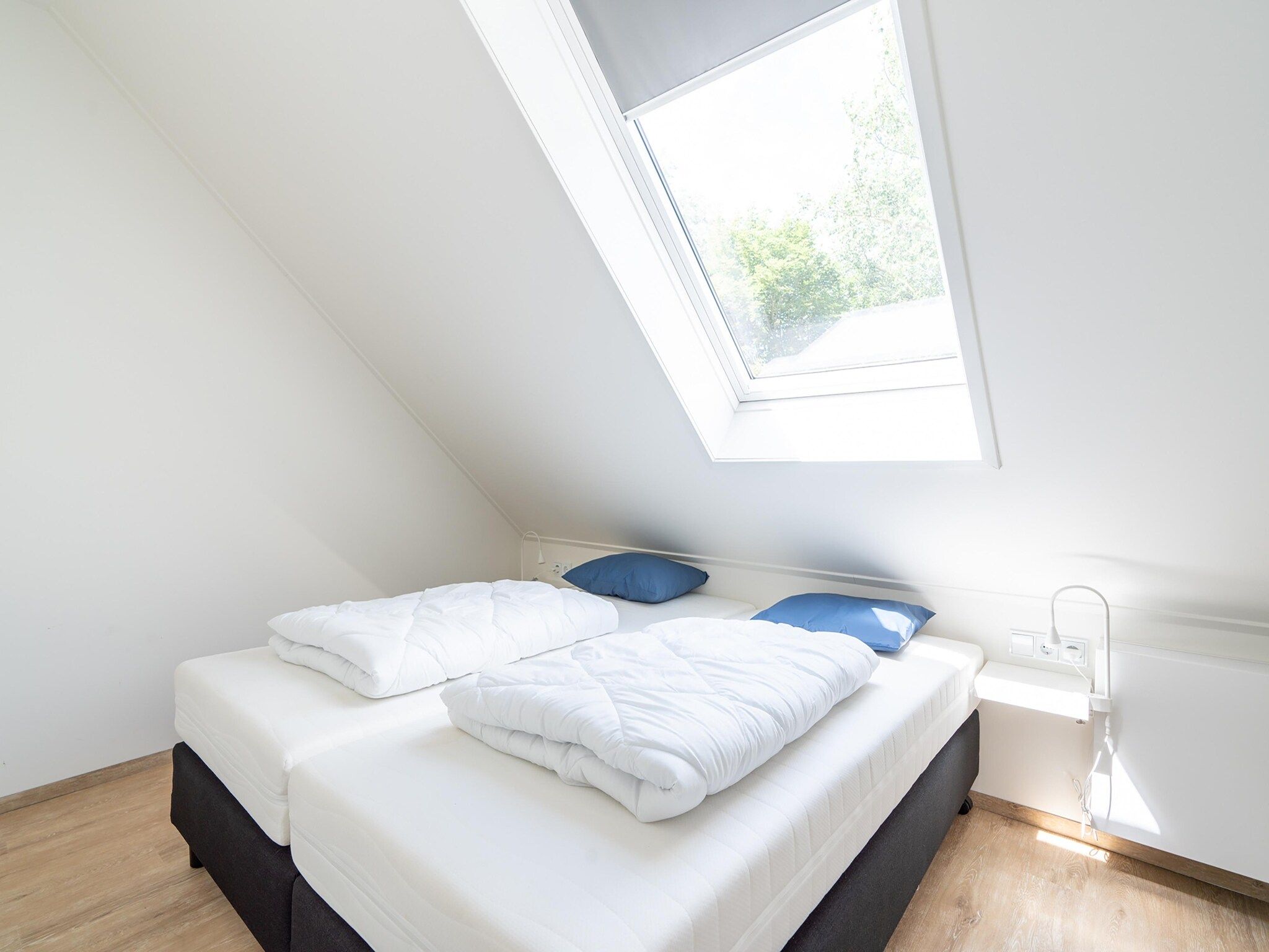 Een slaapkamer van Combi Vrijersduin en Kaapsduin in Nes