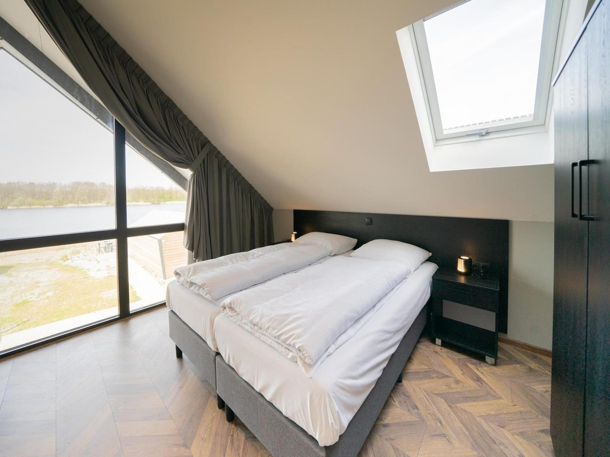 Een slaapkamer van Resort De IJssel Eilanden 8 in Kampen