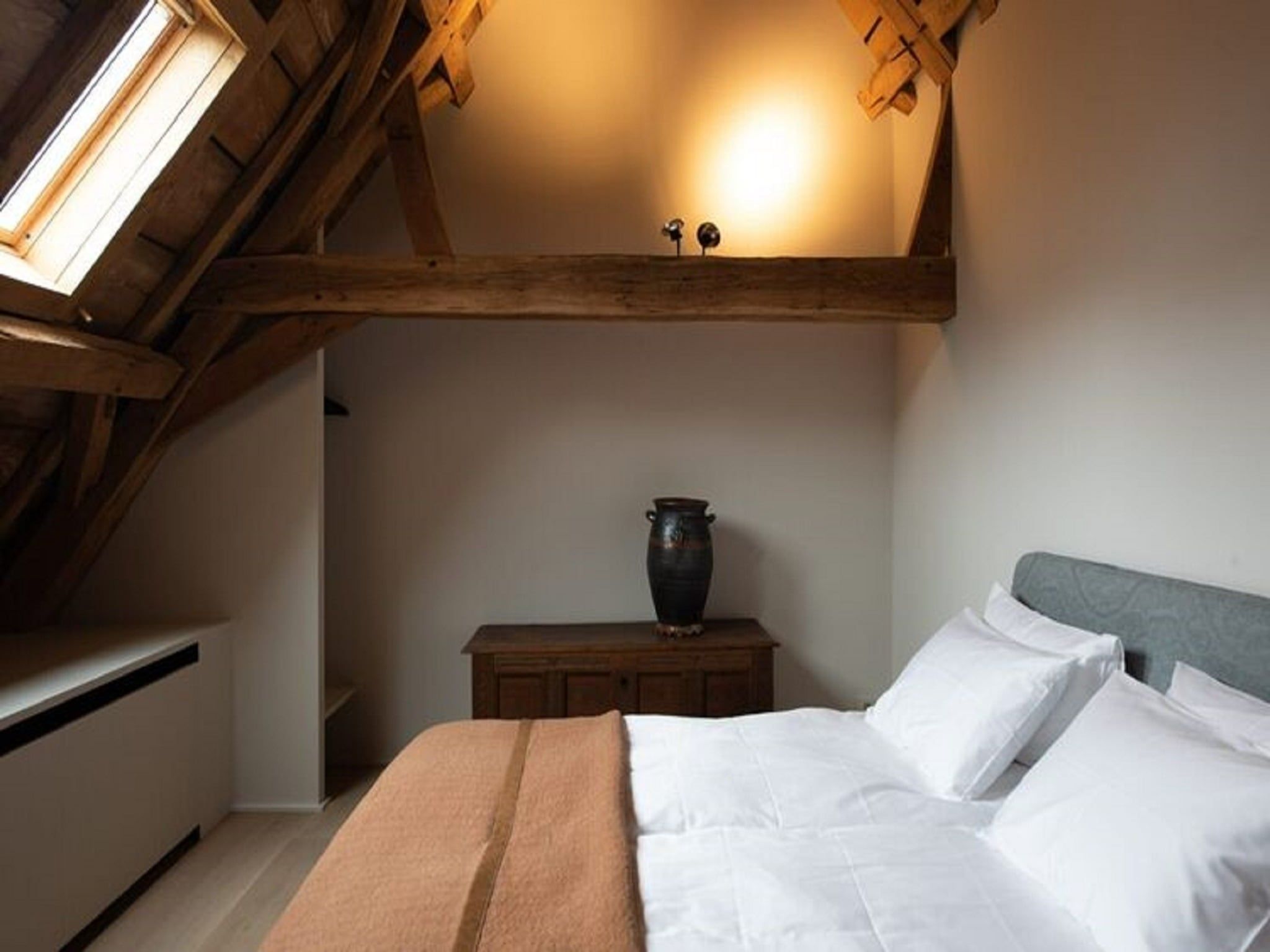 Een slaapkamer van Herenhoeve de Bockhof in Schimmert