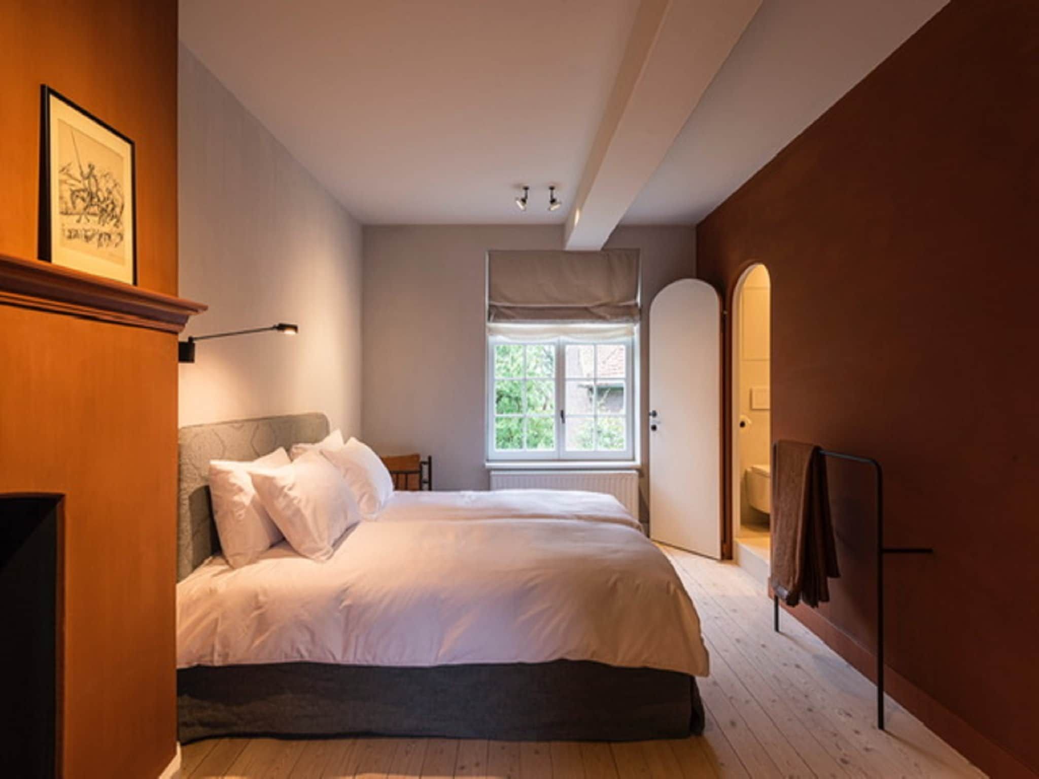 Een slaapkamer van Herenhoeve de Bockhof in Schimmert