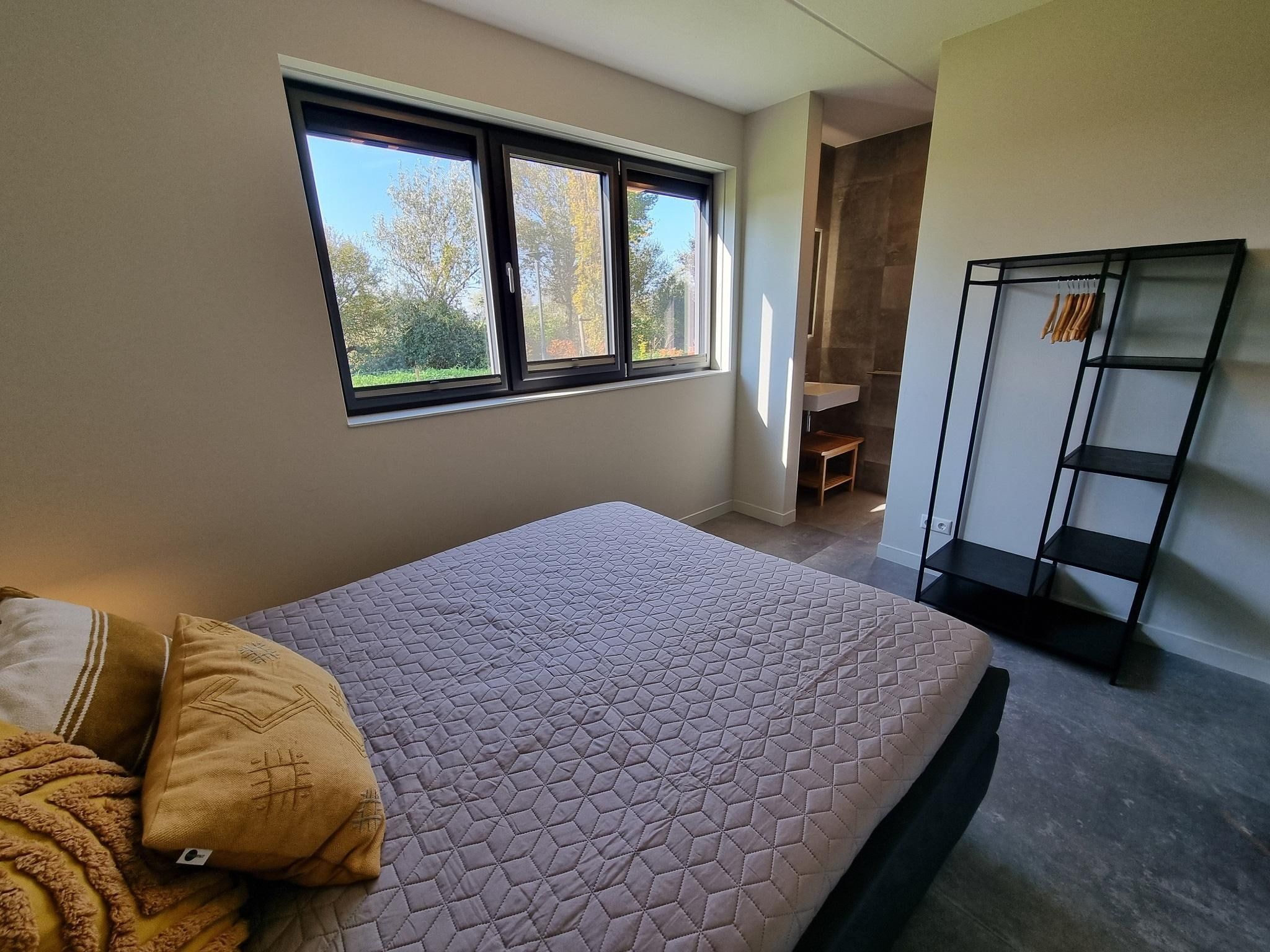 Een slaapkamer van Watervilla Twa in Balk