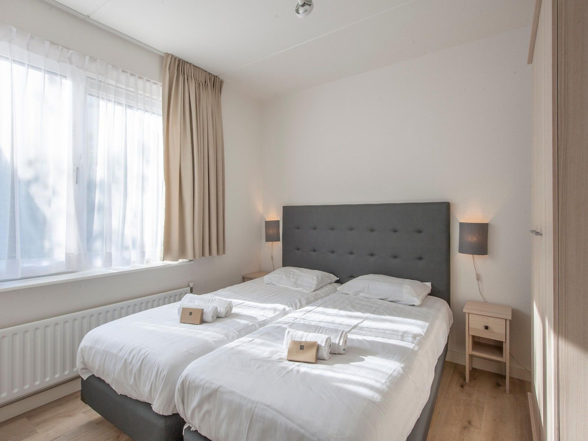 Een slaapkamer van Vakantiepark Zeeland Village 4 in Scharendijke