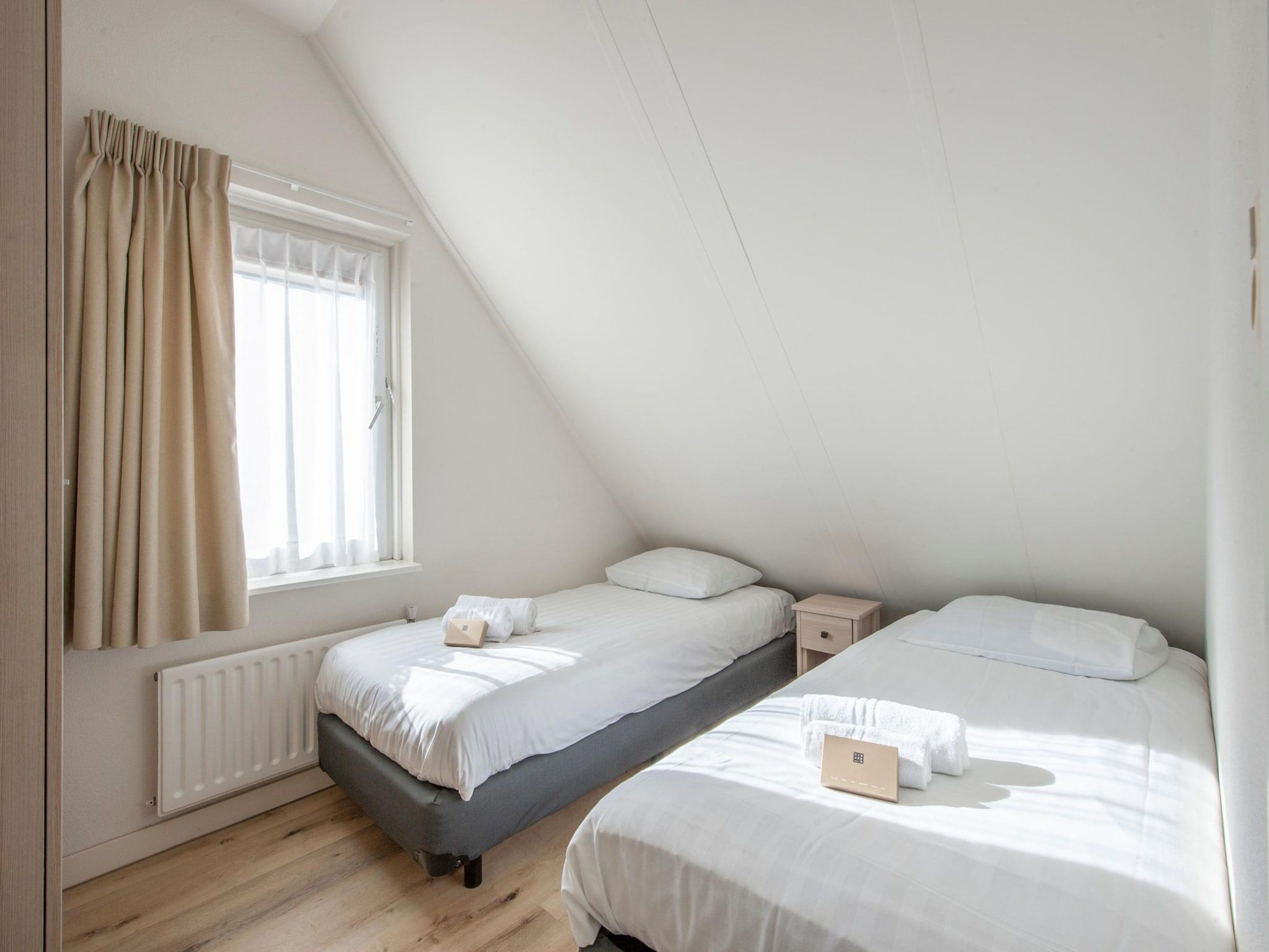 Een slaapkamer van Vakantiepark Zeeland Village 4 in Scharendijke