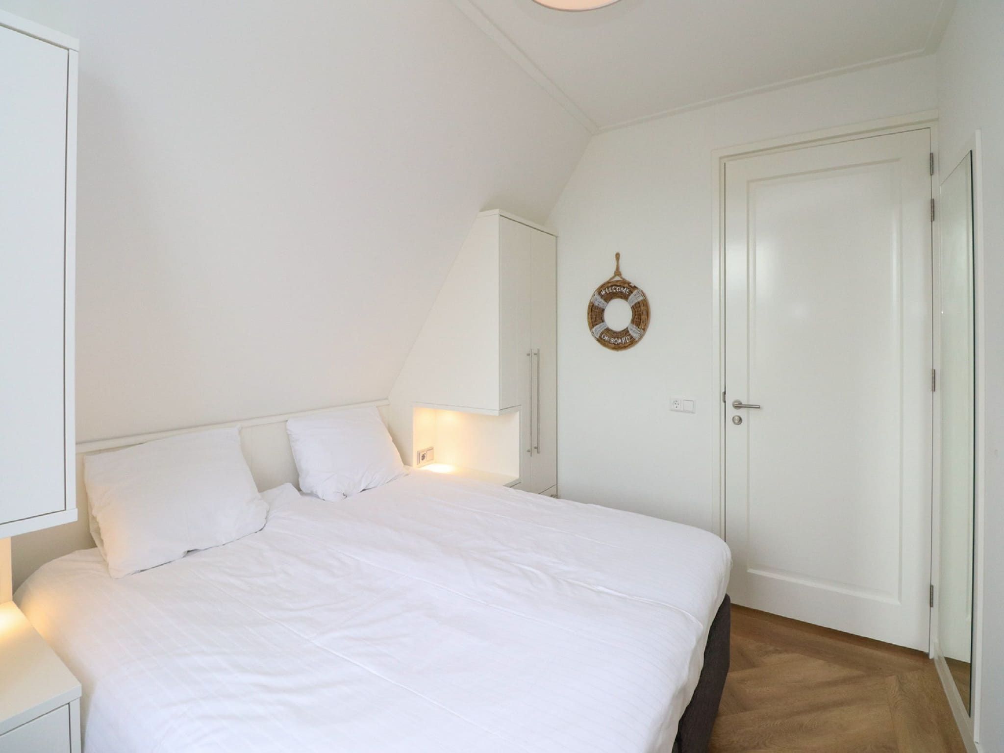 Een slaapkamer van Friese Meren Villa's 16 in Delfstrahuizen