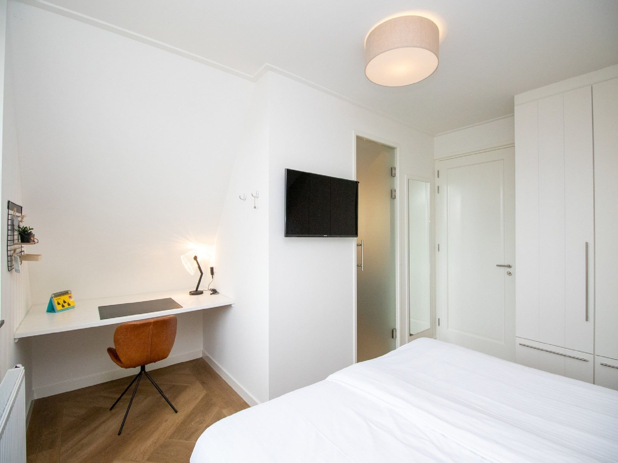 Een slaapkamer van Friese Meren Villa's 16 in Delfstrahuizen