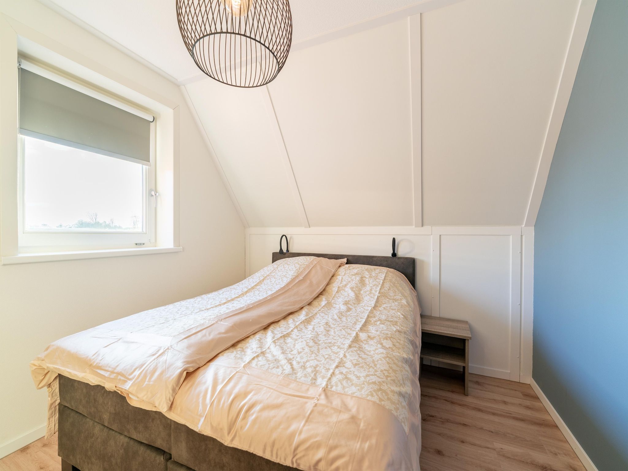 Een slaapkamer van De Ooievaar Huis NR 23 in Scherpenisse