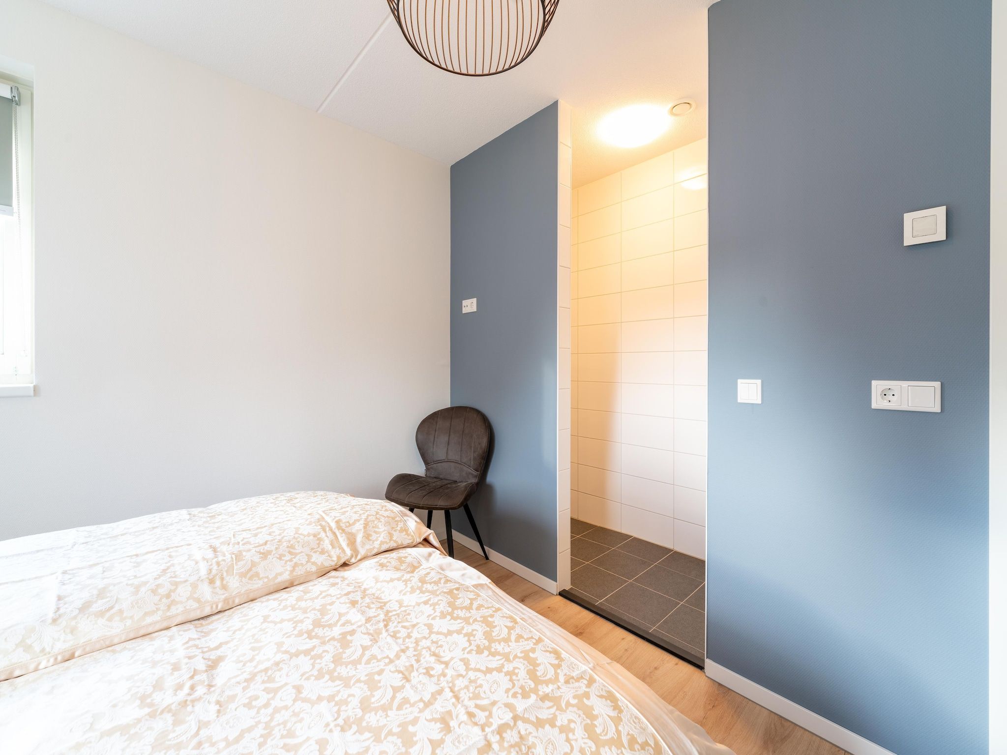 Een slaapkamer van De Ooievaar Huis NR 23 in Scherpenisse