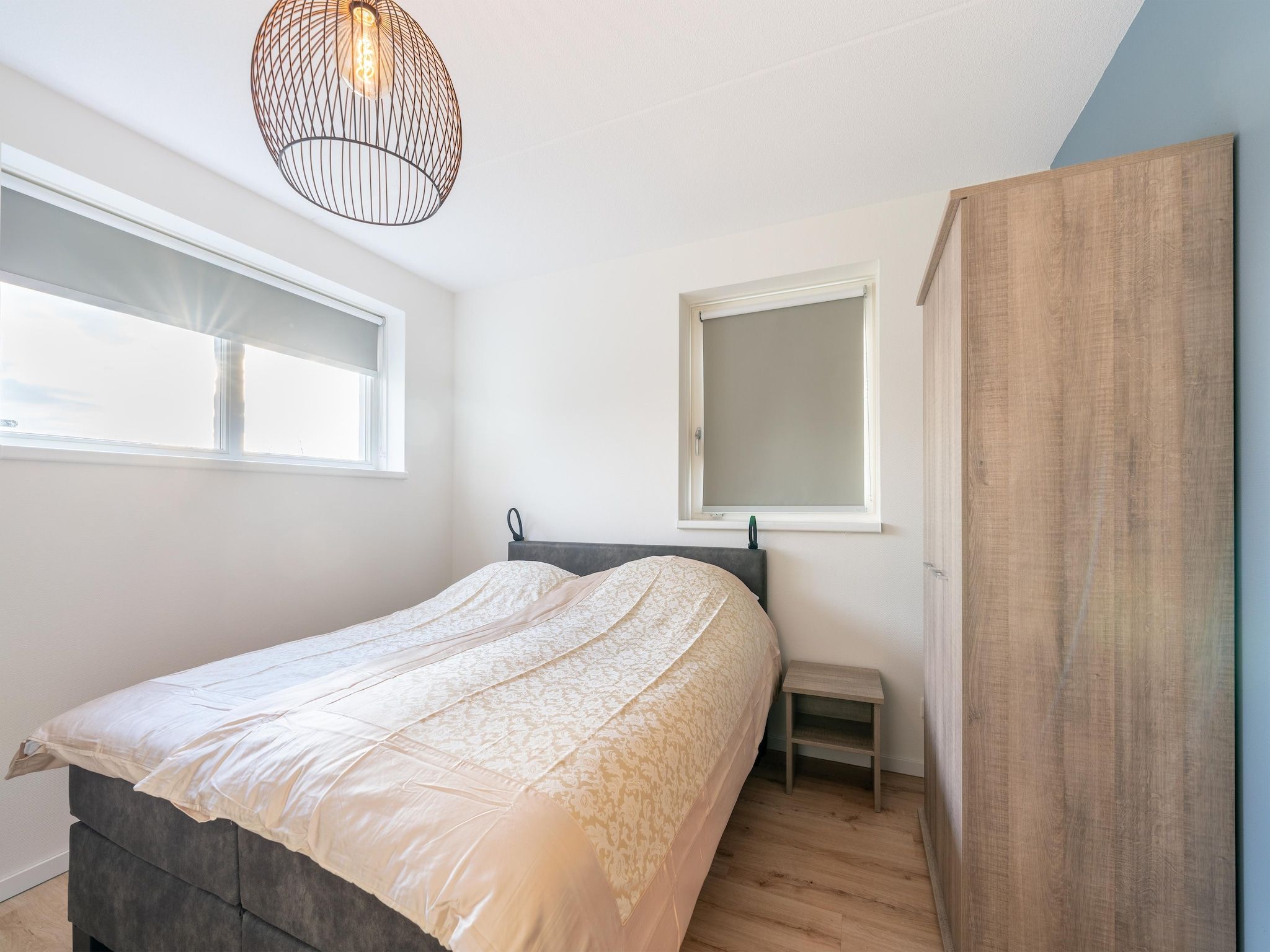 Een slaapkamer van De Ooievaar Huis NR 23 in Scherpenisse