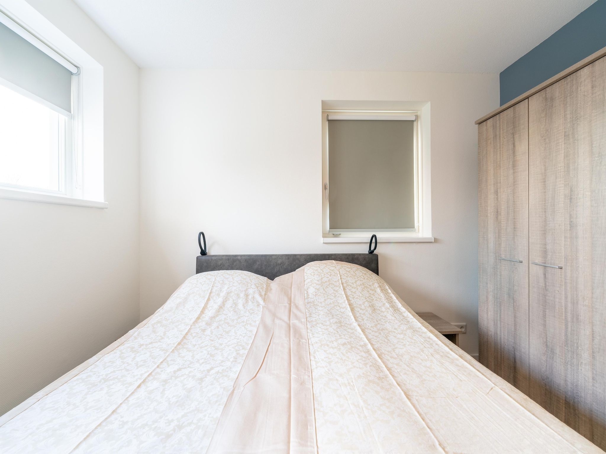 Een slaapkamer van De Ooievaar Huis NR 23 in Scherpenisse