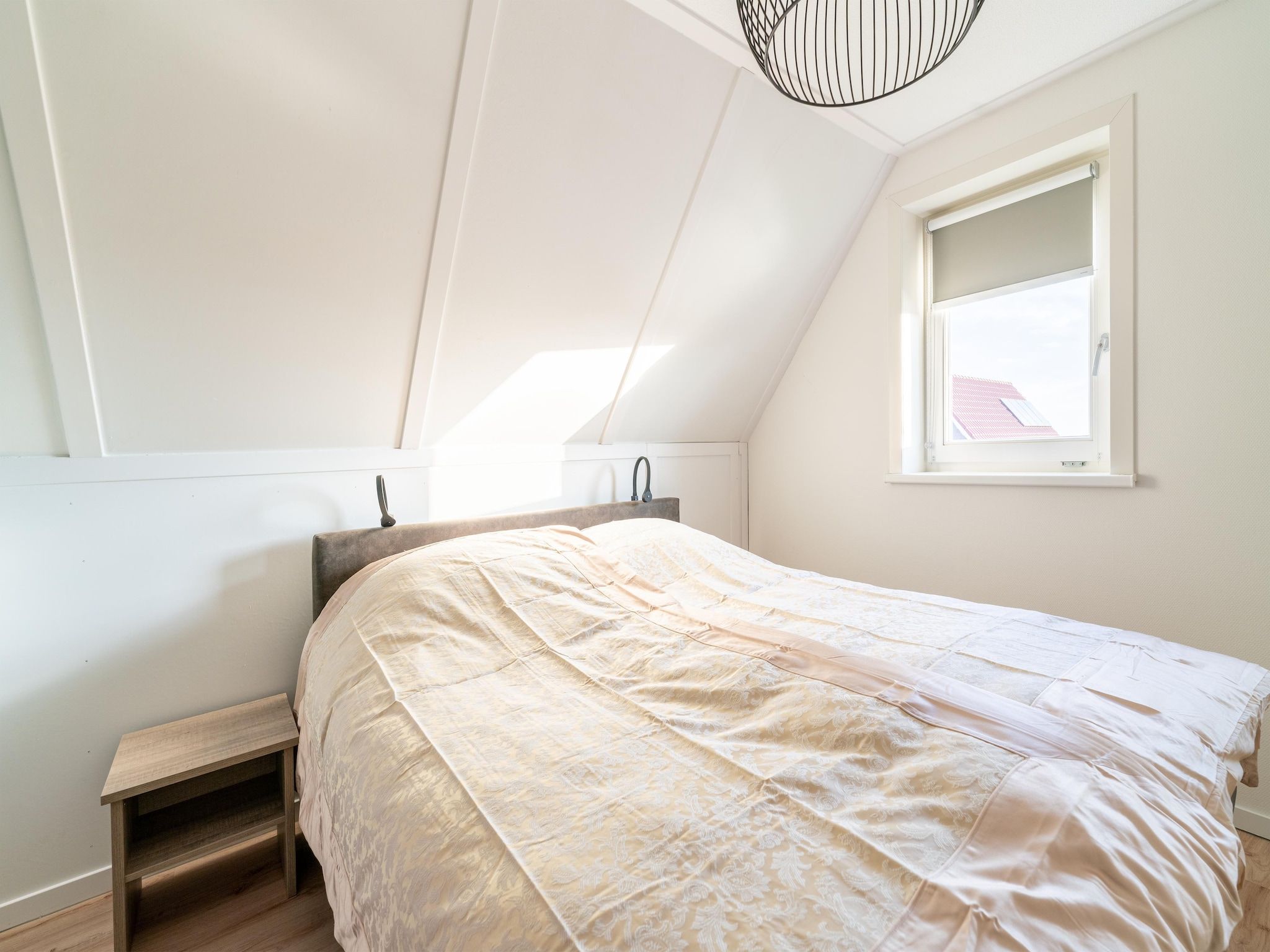 Een slaapkamer van De Ooievaar Huis NR 23 in Scherpenisse