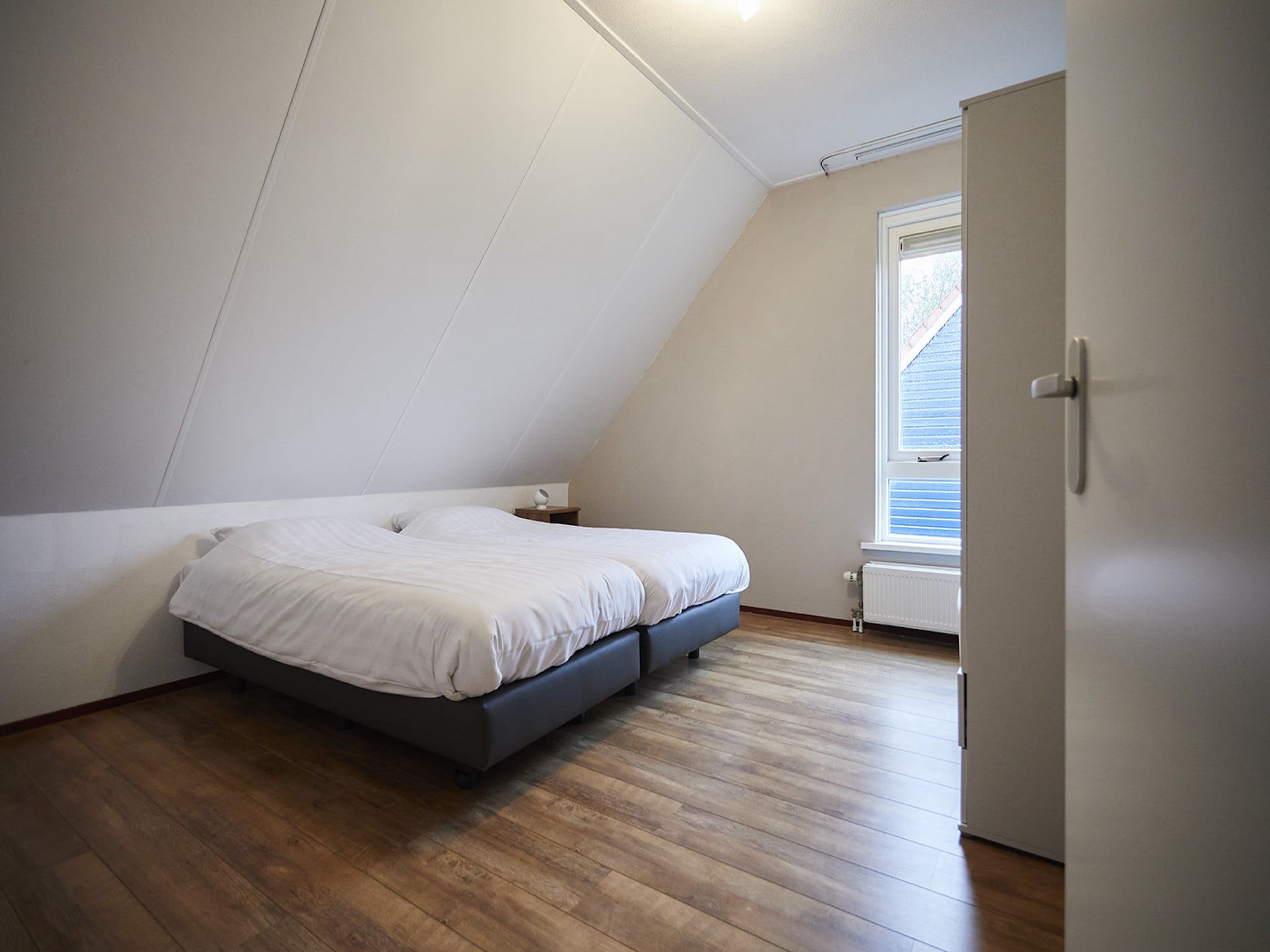 Een slaapkamer van Vakantiepark Hof van Zeeland  8 in Heinkenszand