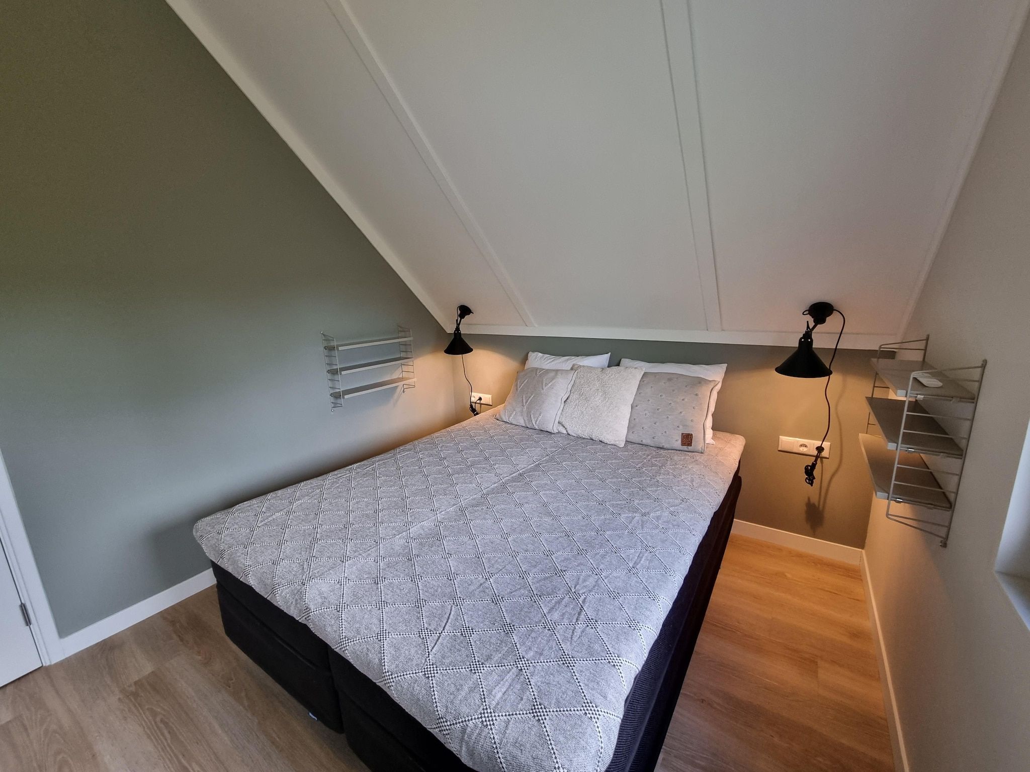 Een slaapkamer van Watervilla Acht in Balk