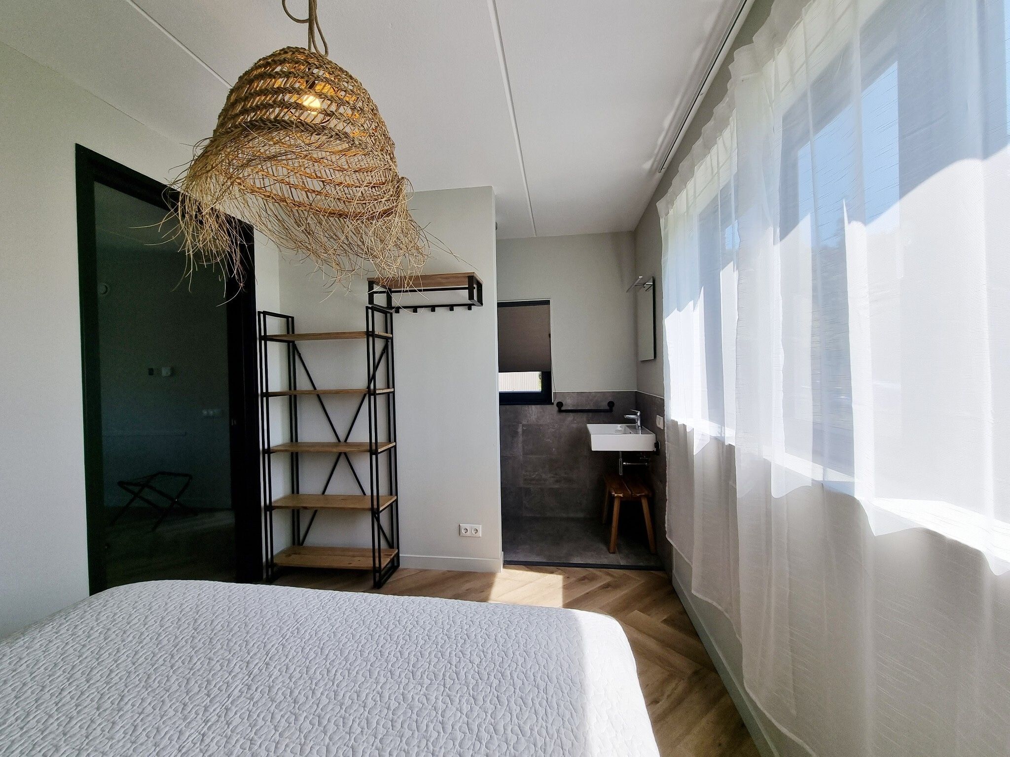 Een slaapkamer van Watervilla Tolve in Balk