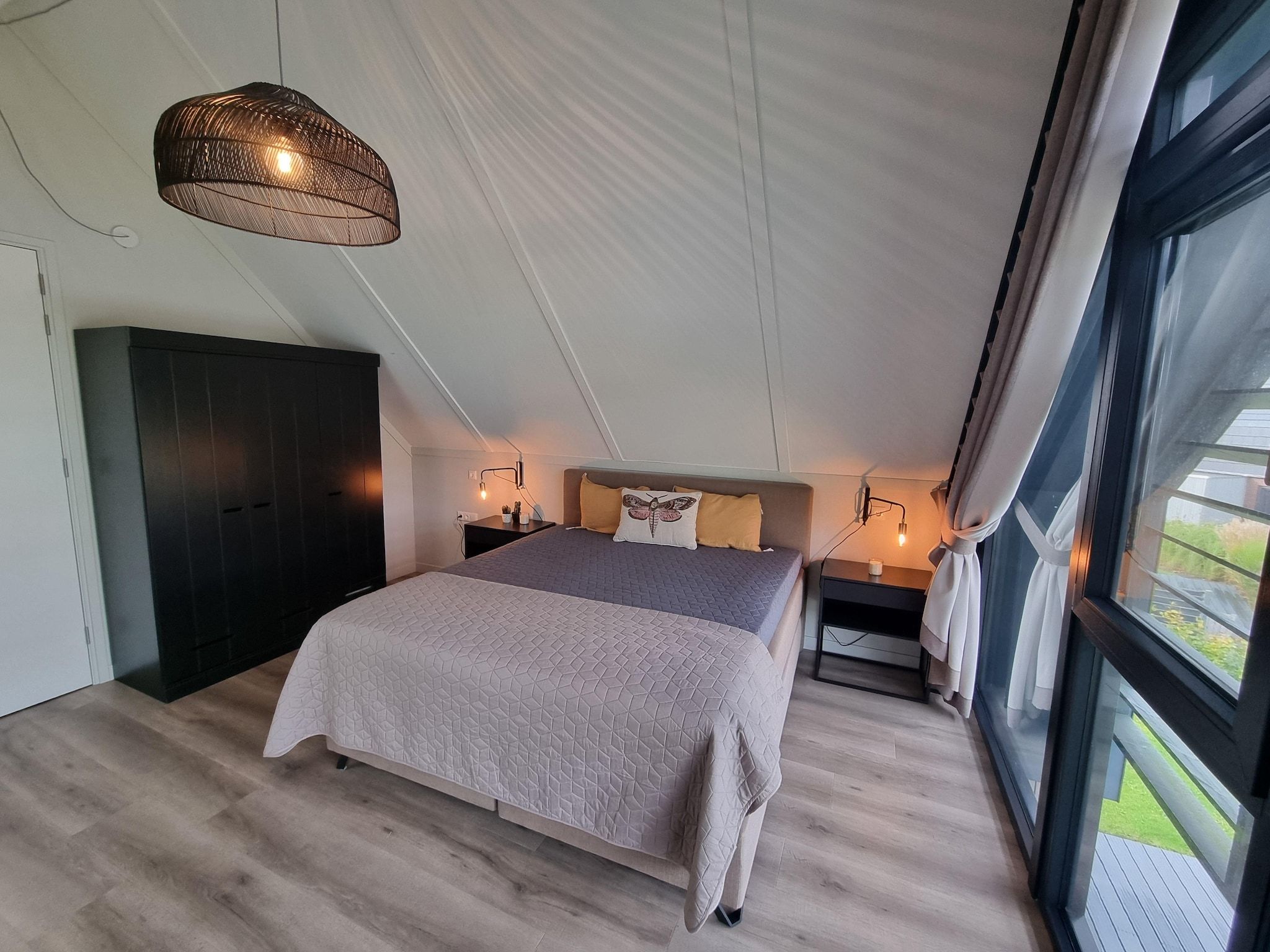 Een slaapkamer van Watervilla Tolve in Balk