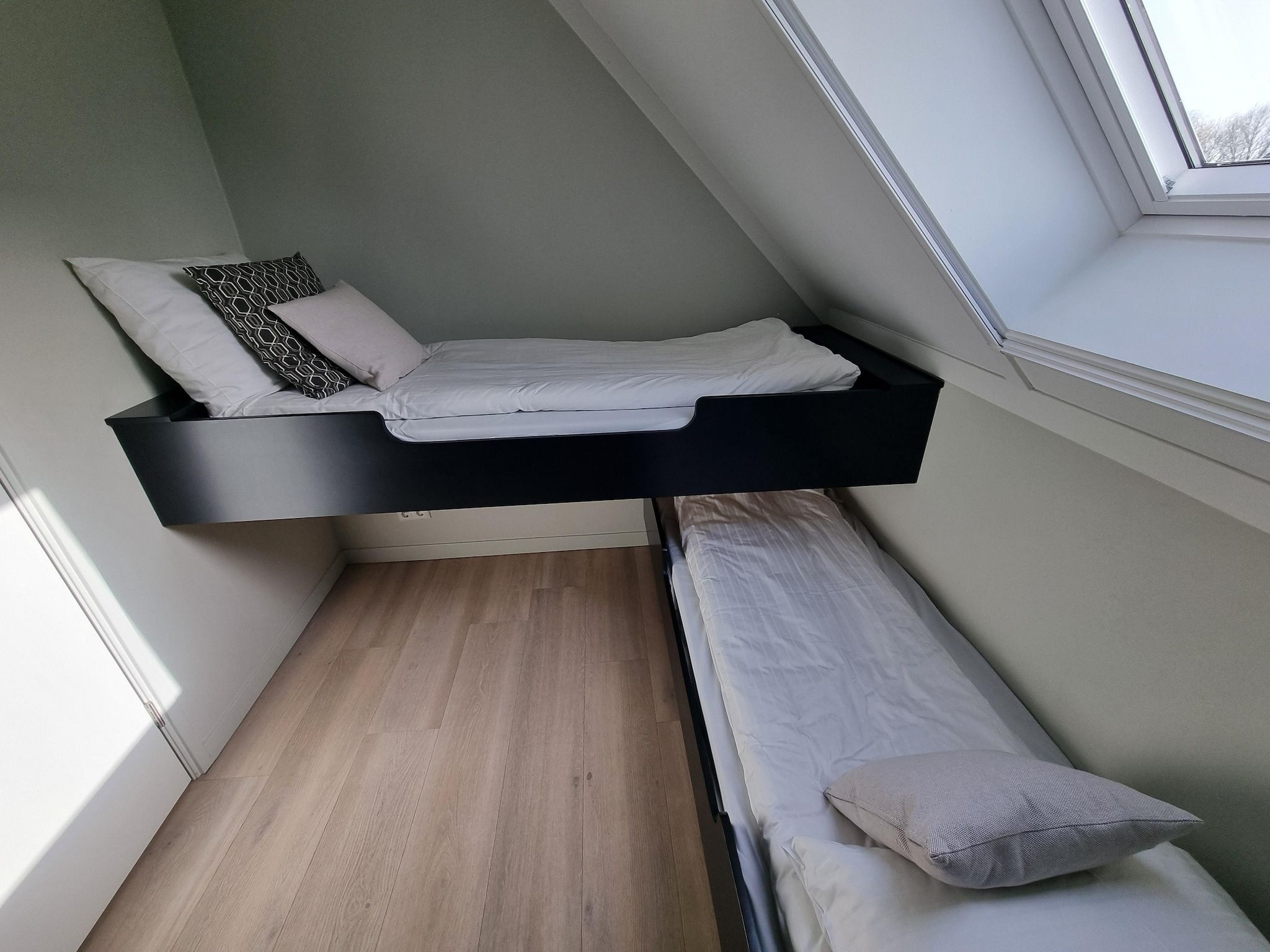 Een slaapkamer van Watervilla Santjin in Balk