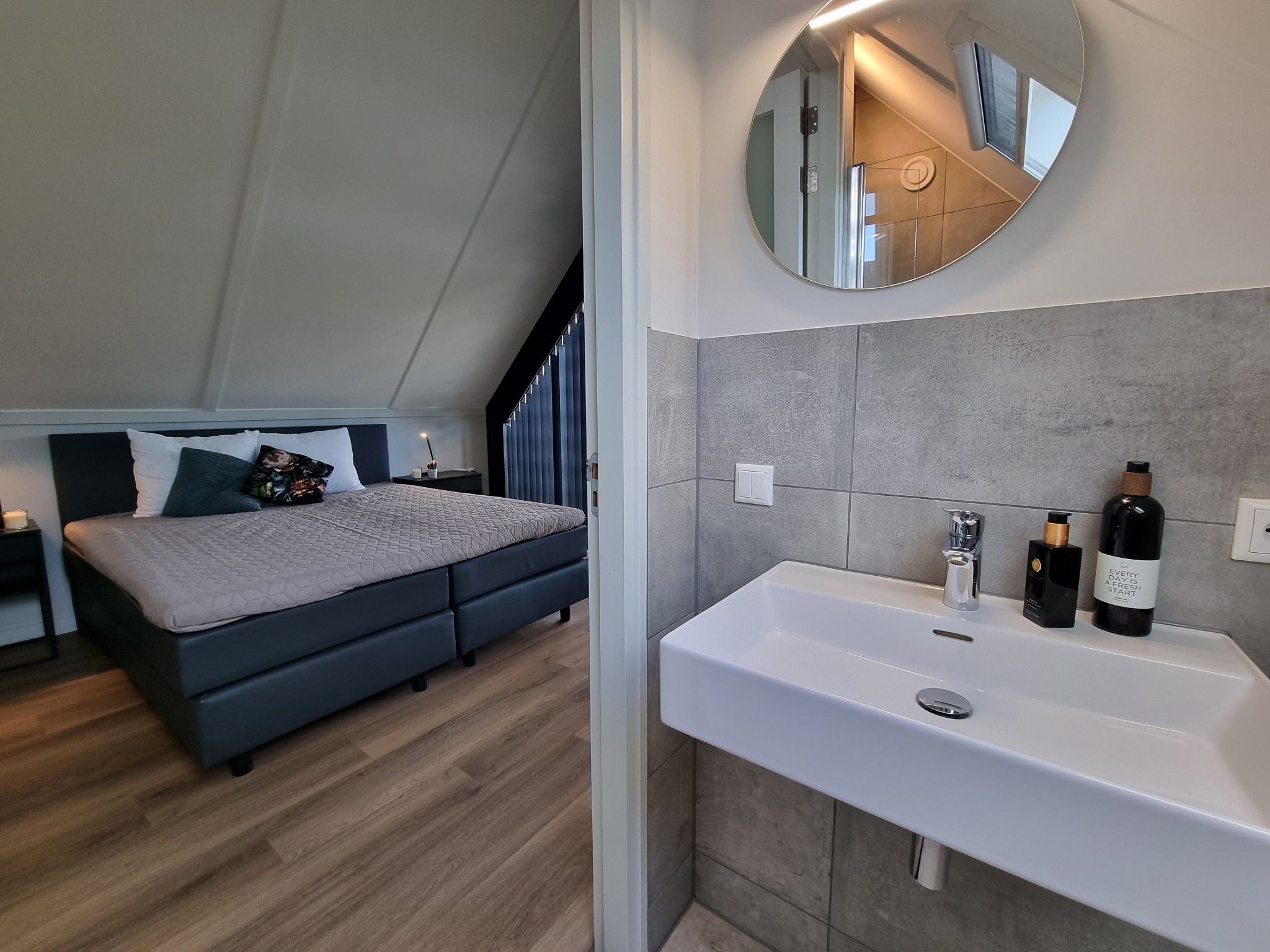 Een slaapkamer van Watervilla Fiif in Balk