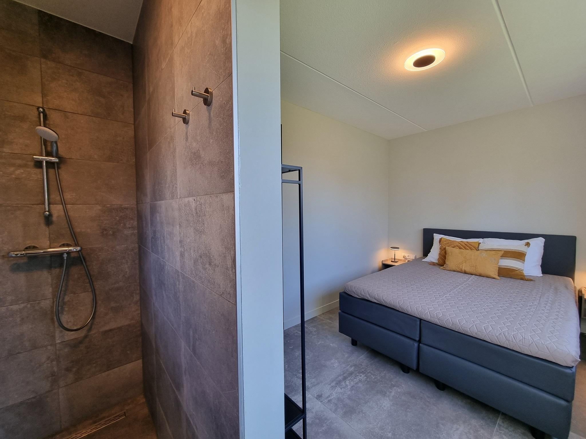 Een slaapkamer van Watervilla Fiif in Balk