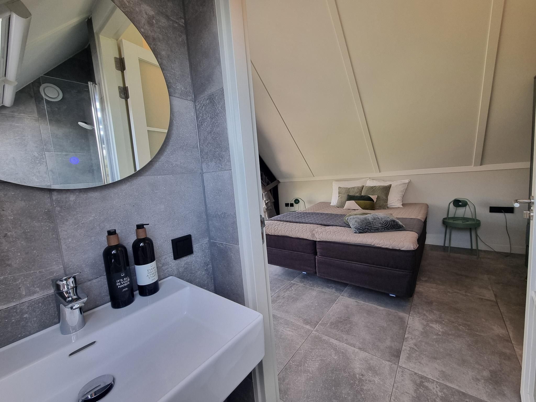 Een slaapkamer van Watervilla Tsien in Balk