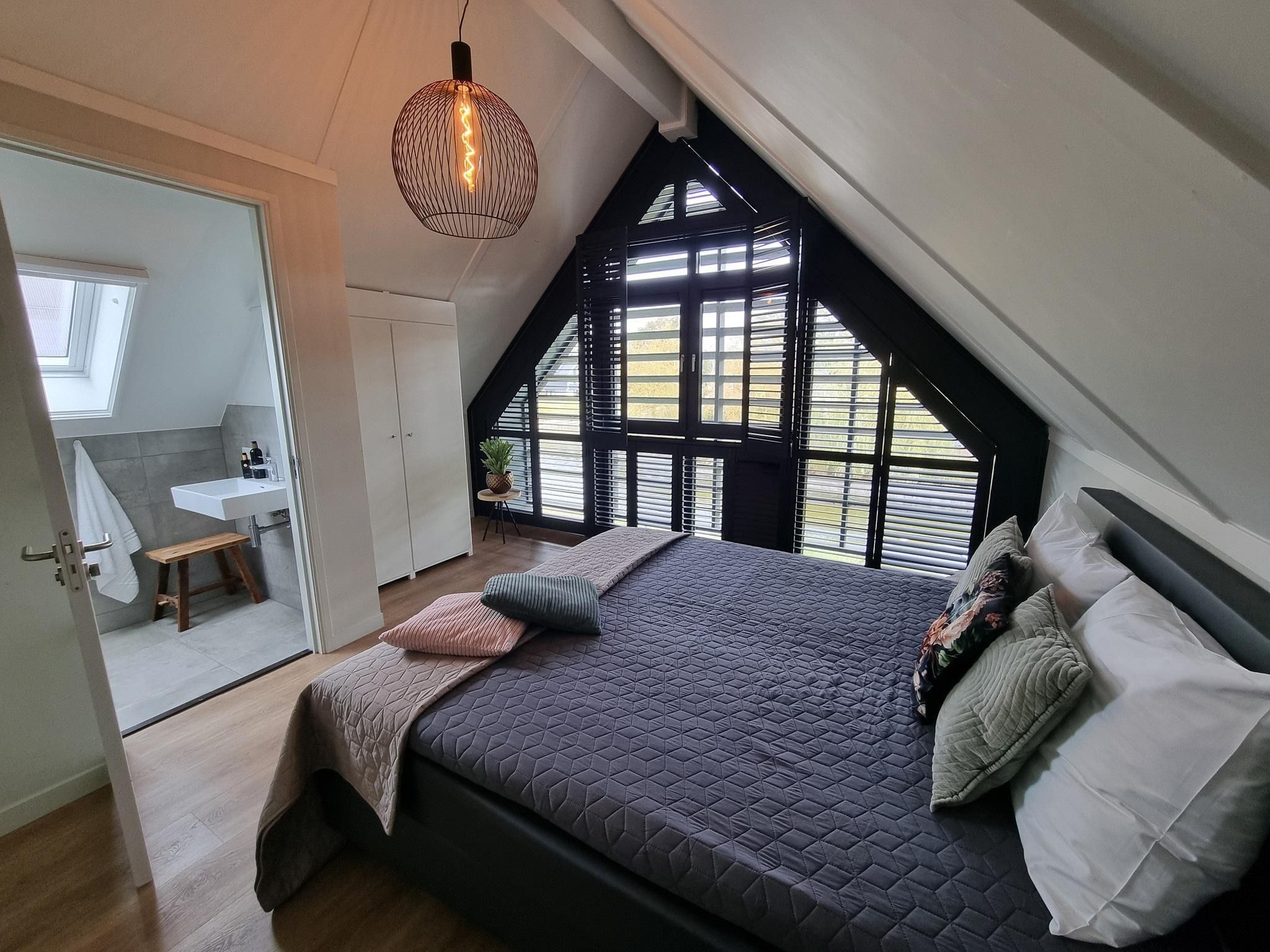 Een slaapkamer van Watervilla Trettjin in Balk