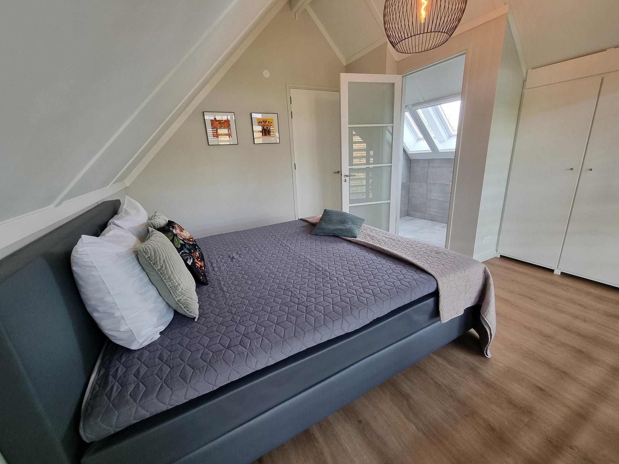 Een slaapkamer van Watervilla Trettjin in Balk