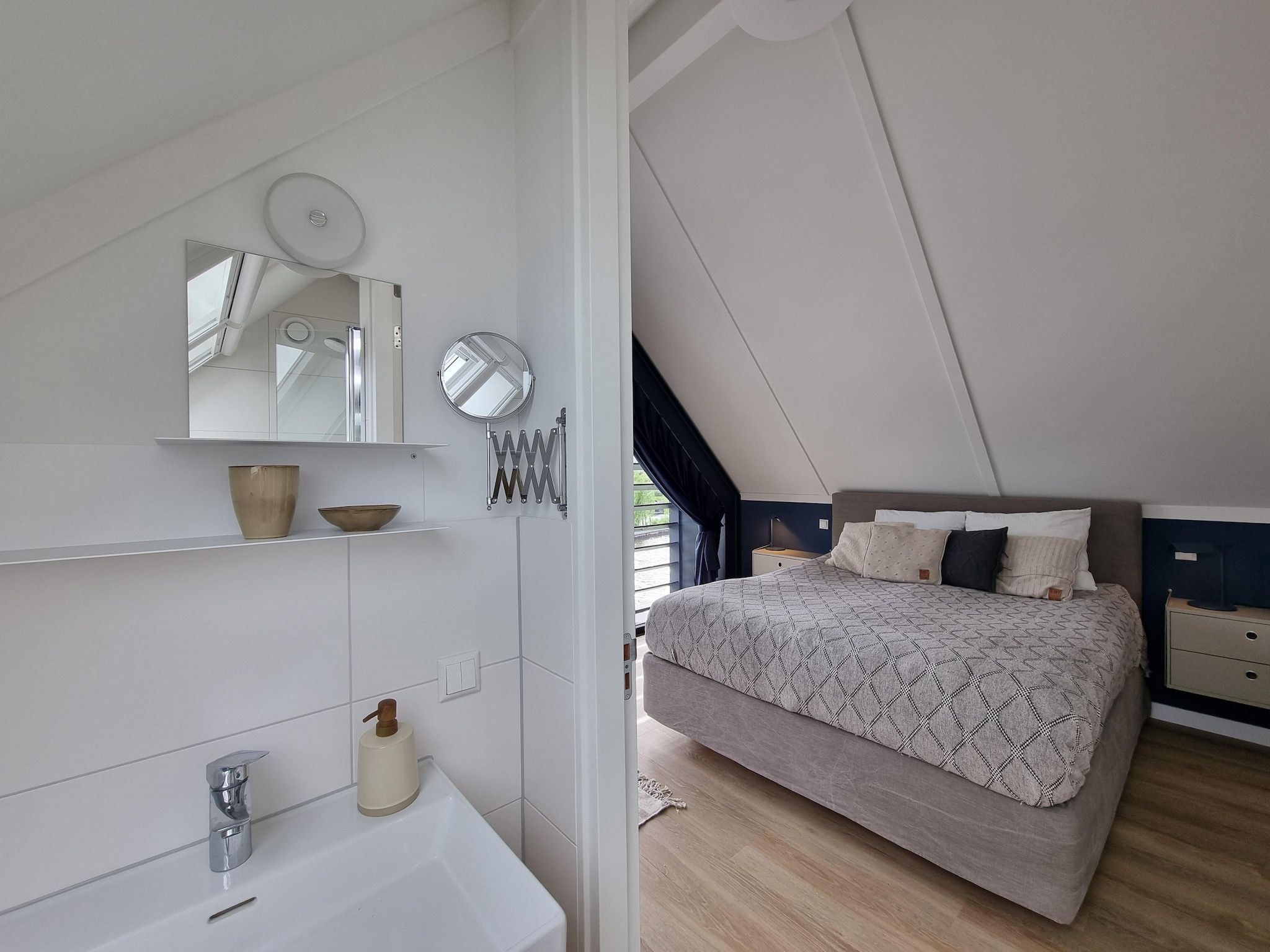 Een slaapkamer van Watervilla Fiiftjin in Balk