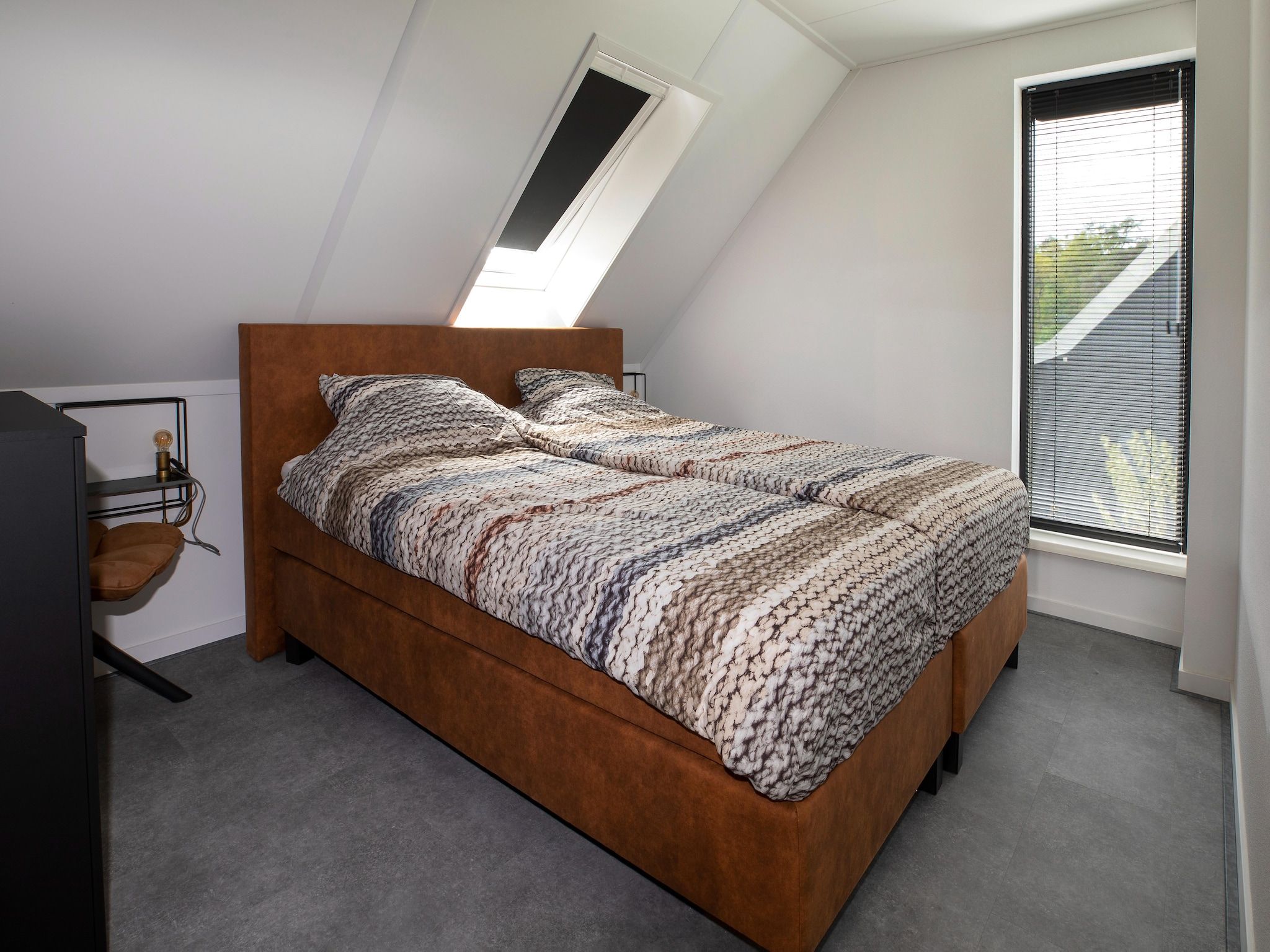 Een slaapkamer van Landgoed Eysinga State 6 in Sint Nicolaasga