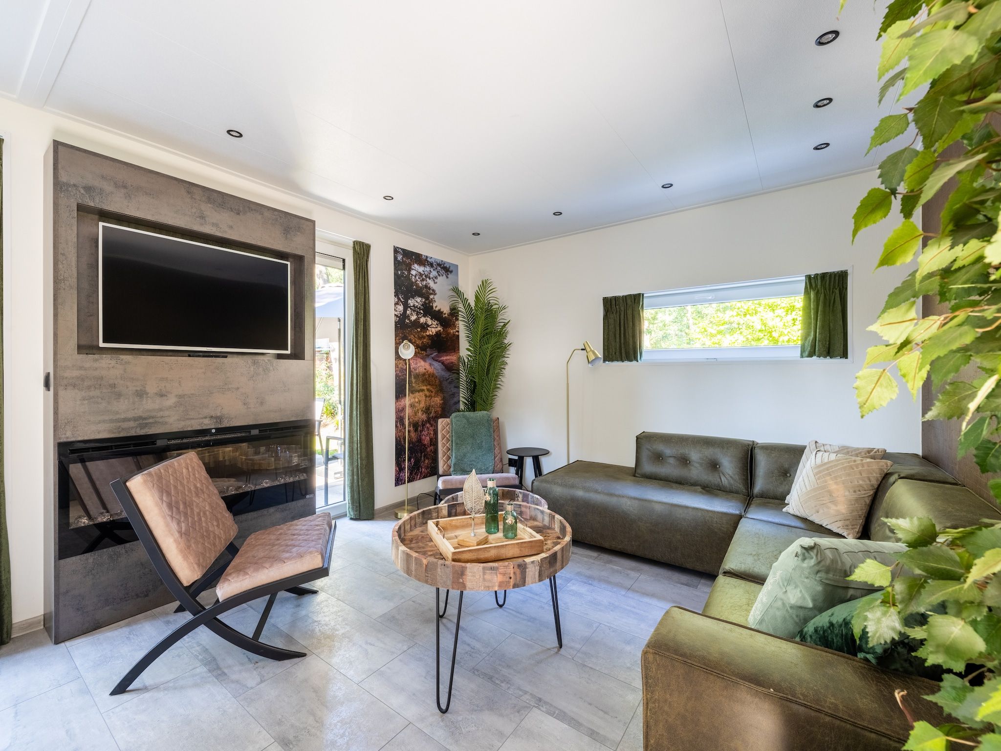 De woonkamer van Vakantiepark De Rimboe & De Woeste Hoogte 38 in Hoenderloo