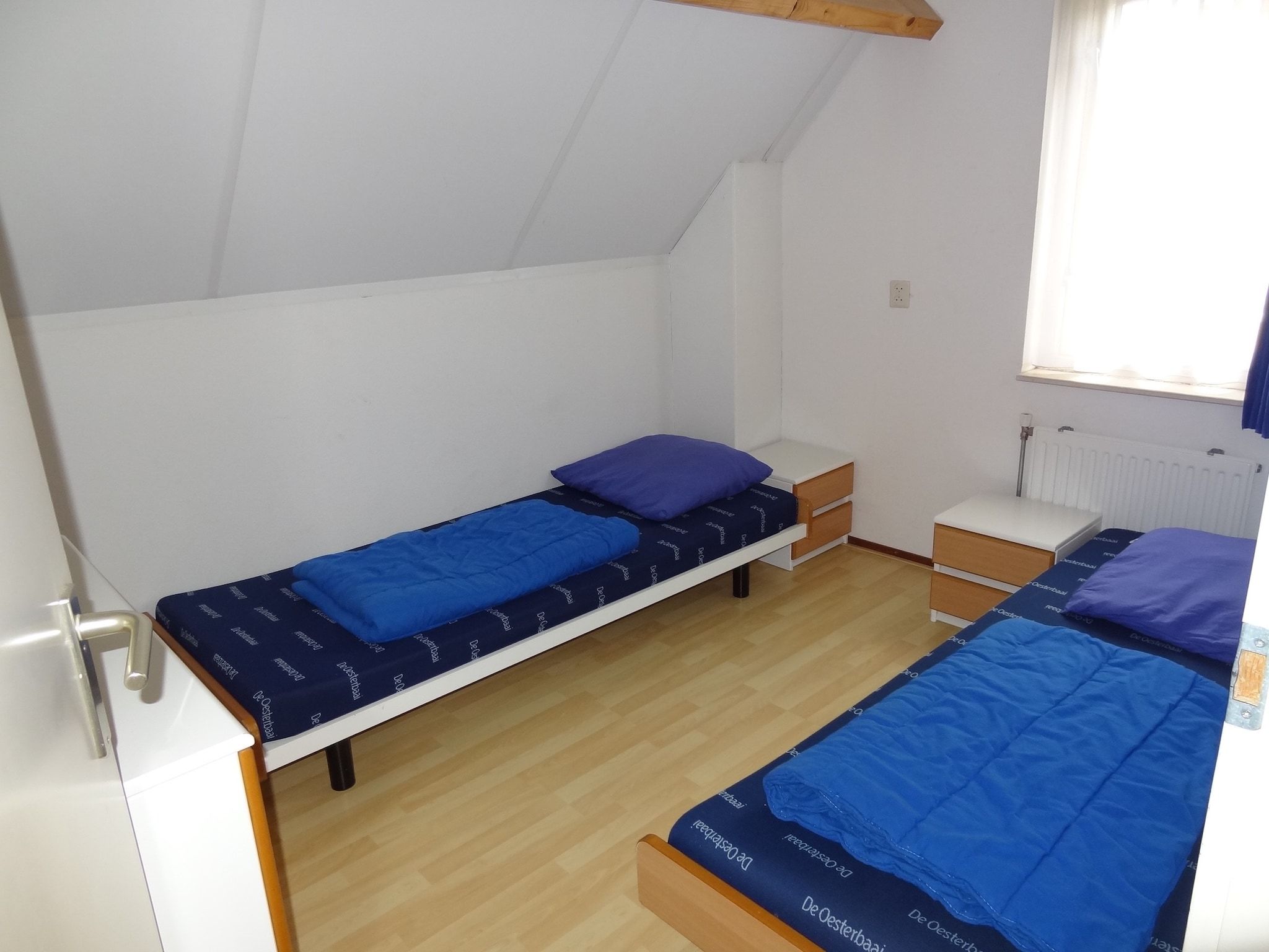 Een slaapkamer van Villapark De Oesterbaai 15 in Wemeldinge