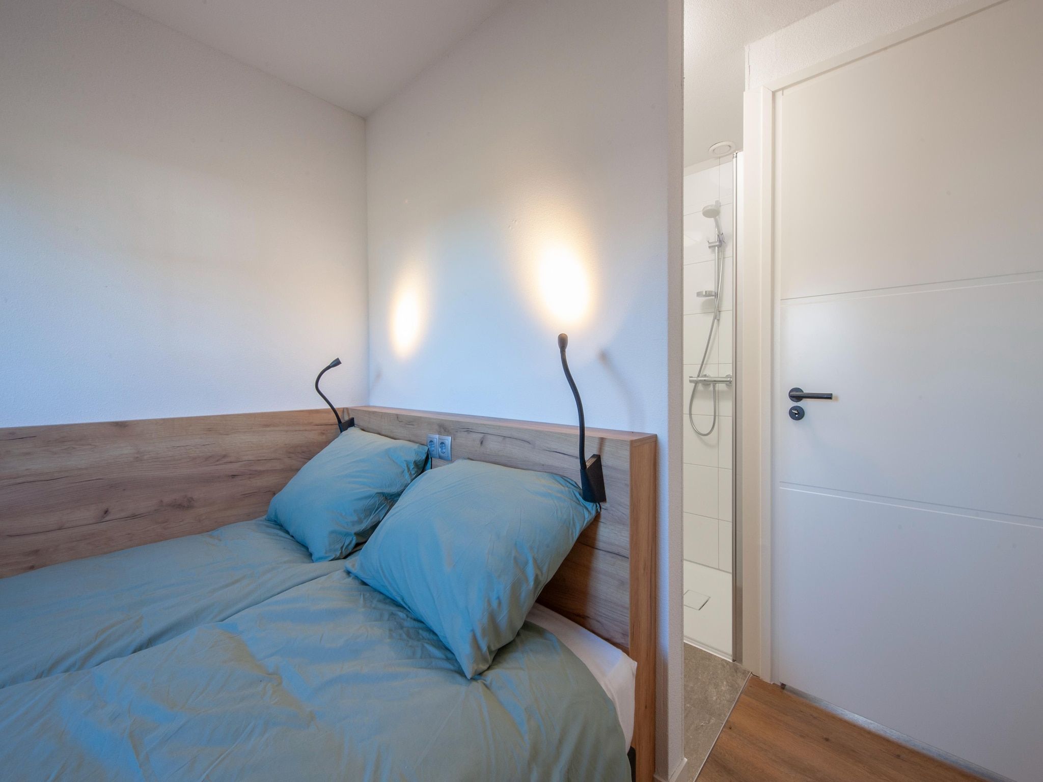 Een slaapkamer van Vakantiepark De Heihorsten 6 in Someren