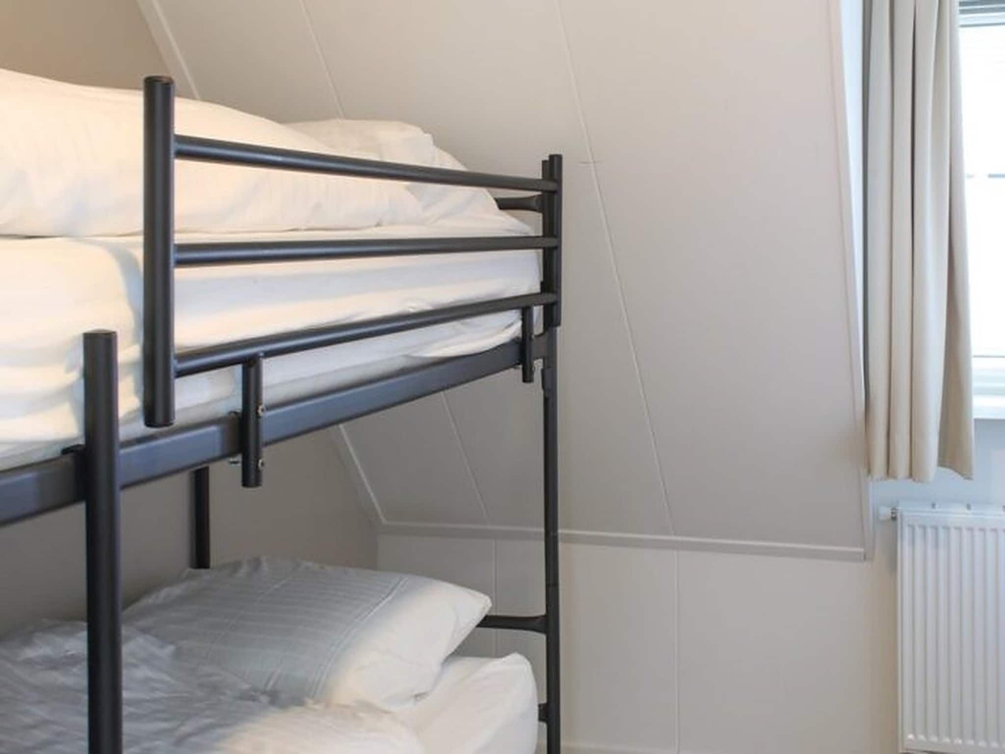 Een slaapkamer van Recreatiepark Idskenhuizen 4 in Idskenhuizen