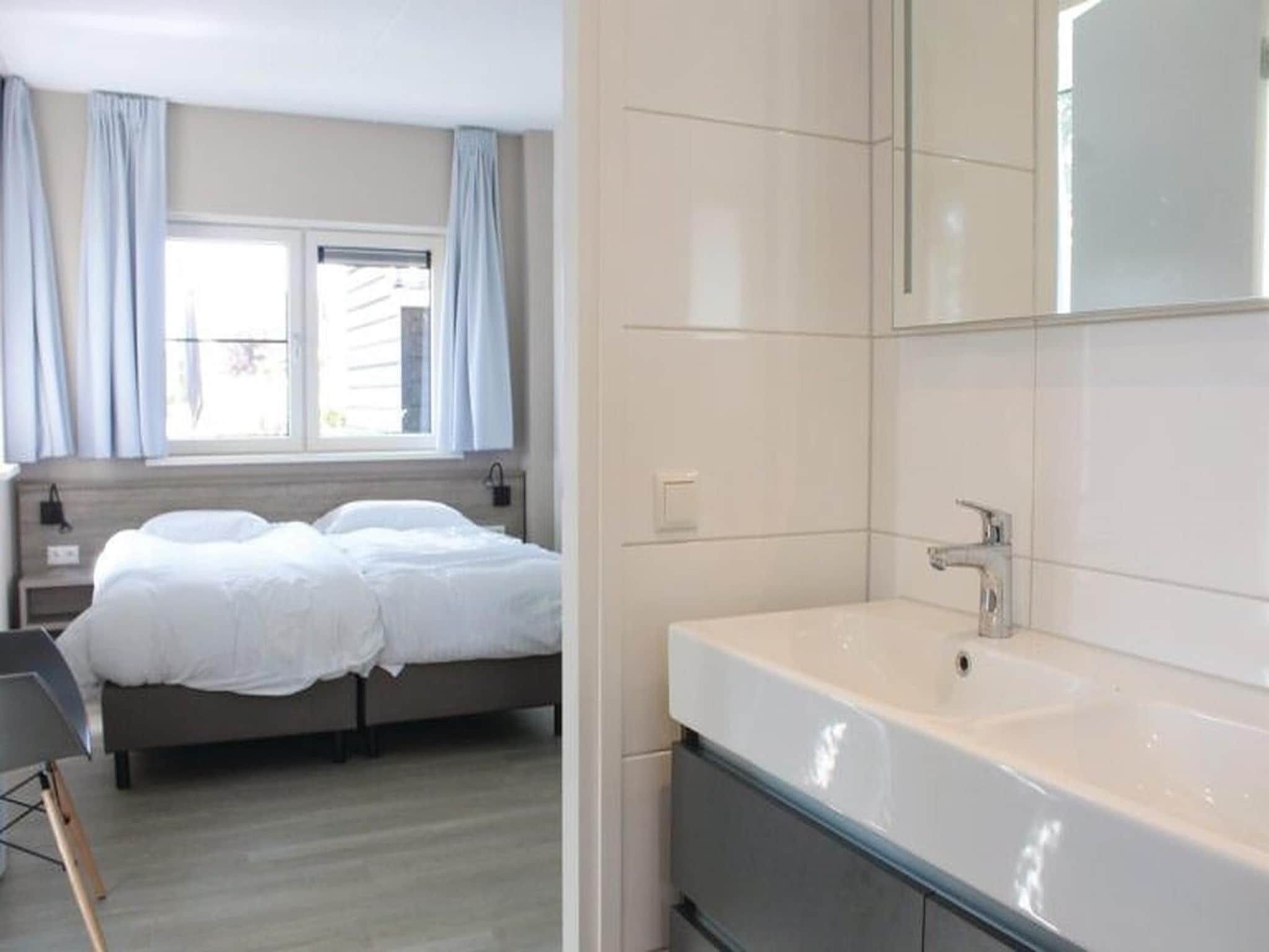 Een slaapkamer van Recreatiepark Idskenhuizen 6 in Idskenhuizen