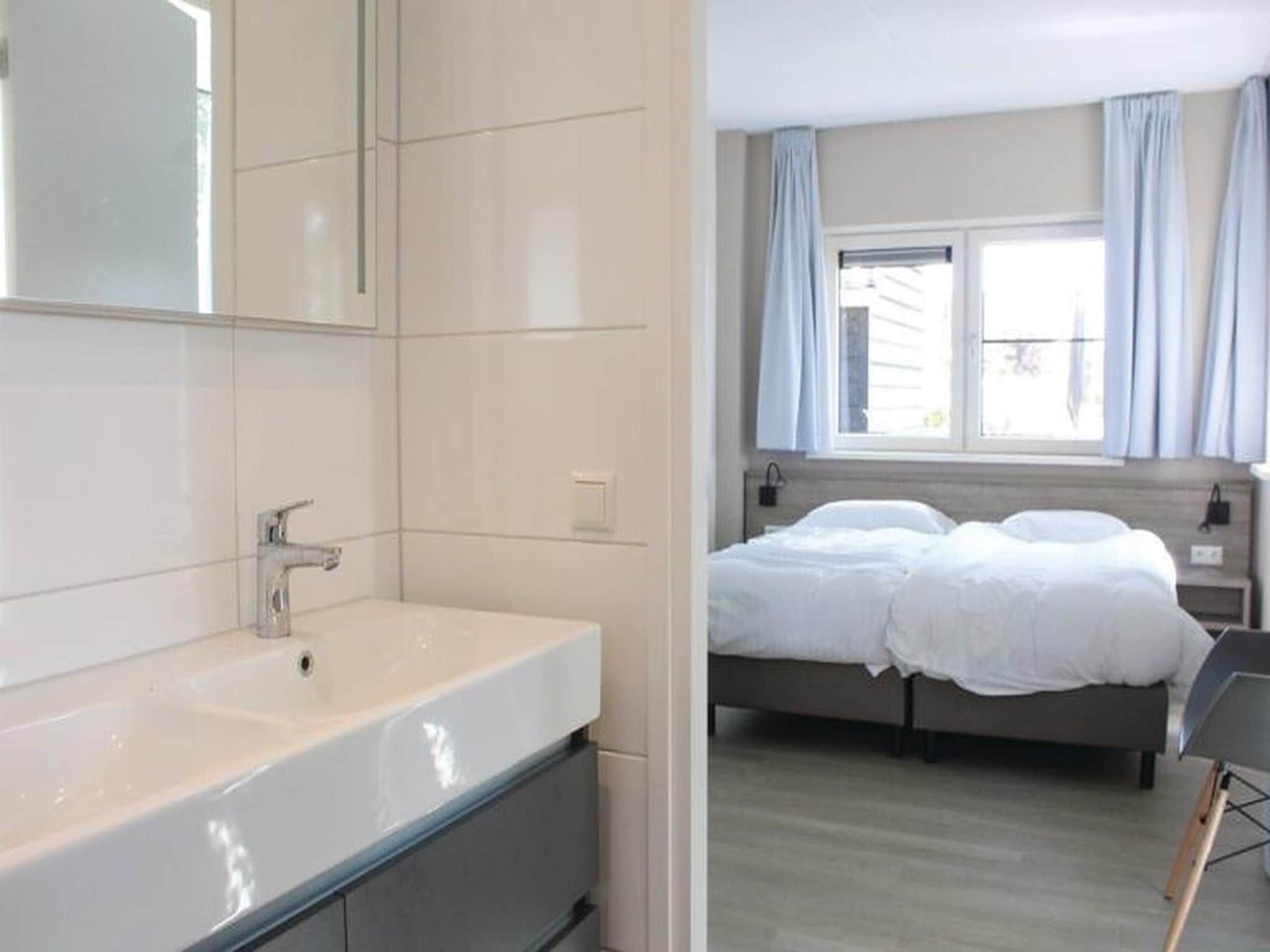 Een slaapkamer van Recreatiepark Idskenhuizen 6 in Idskenhuizen