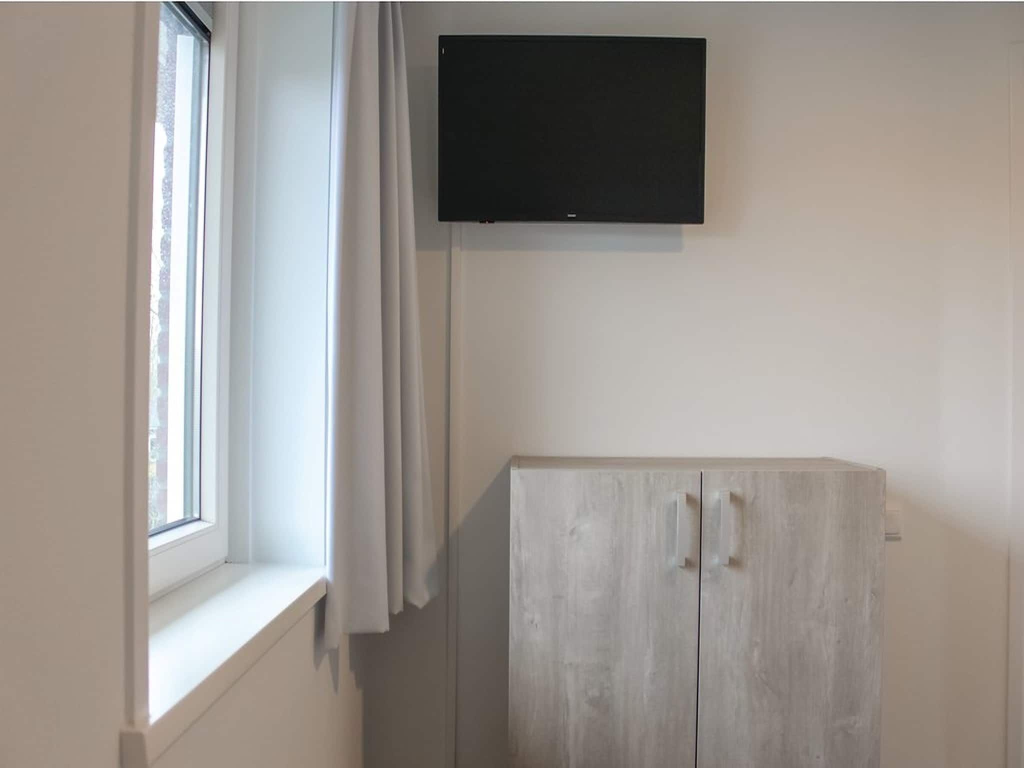 De woonkamer van Recreatiepark Idskenhuizen 9 in Idskenhuizen