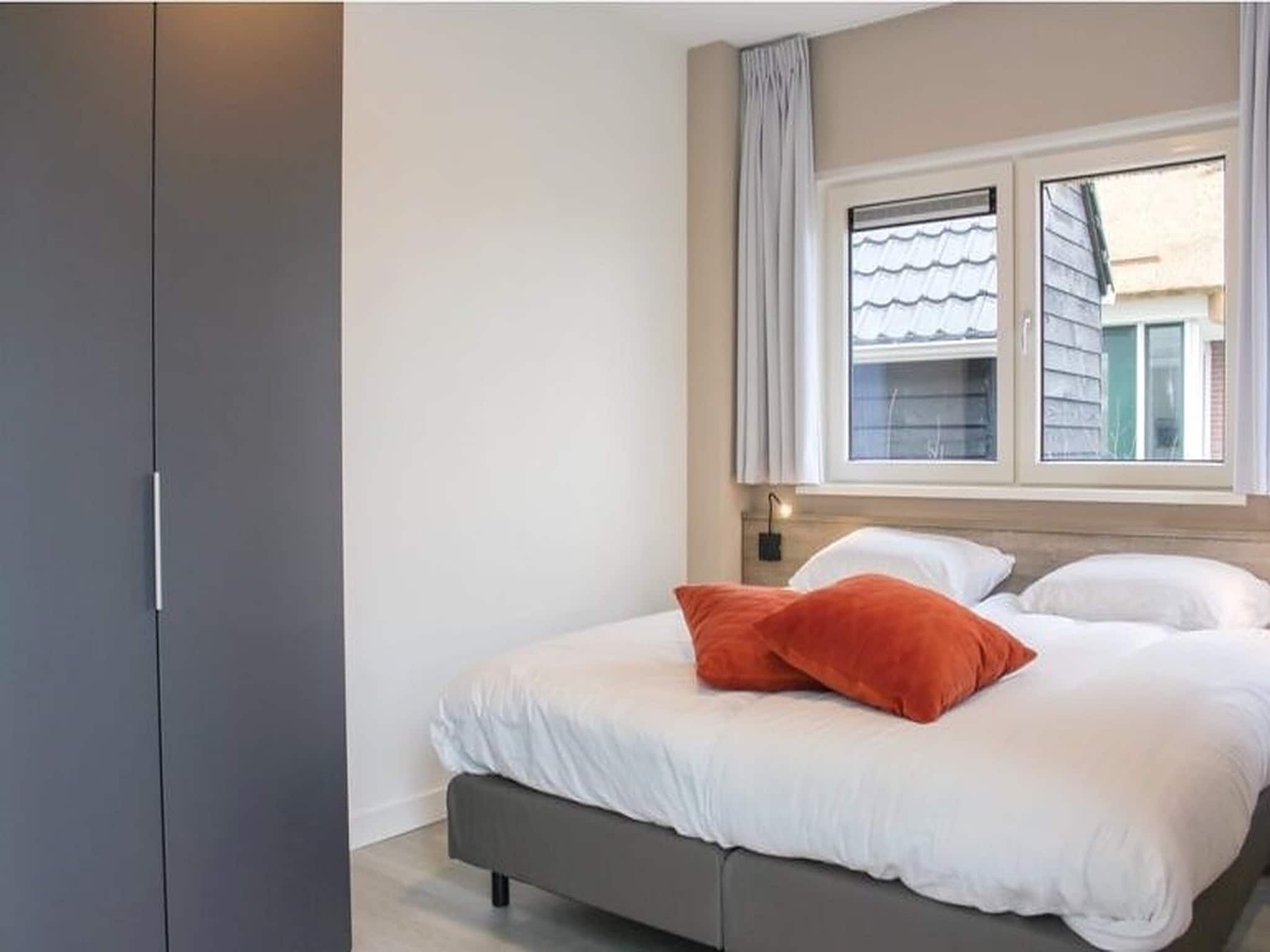 Een slaapkamer van Recreatiepark Idskenhuizen 10 in Idskenhuizen