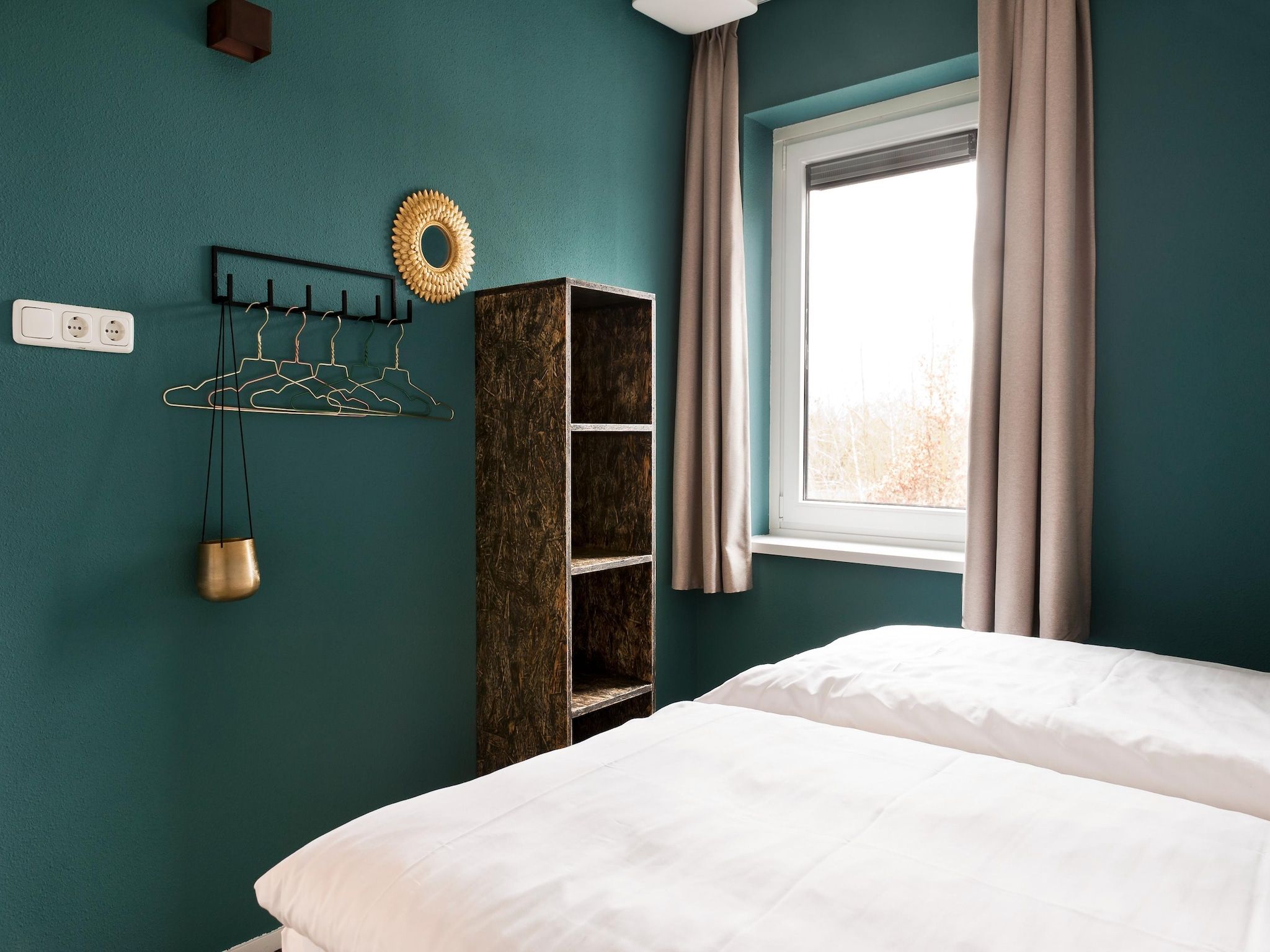 Een slaapkamer van 24 pers Pallertshuis Wellness de luxe met sauna en hout gestookte hottub in Groningen