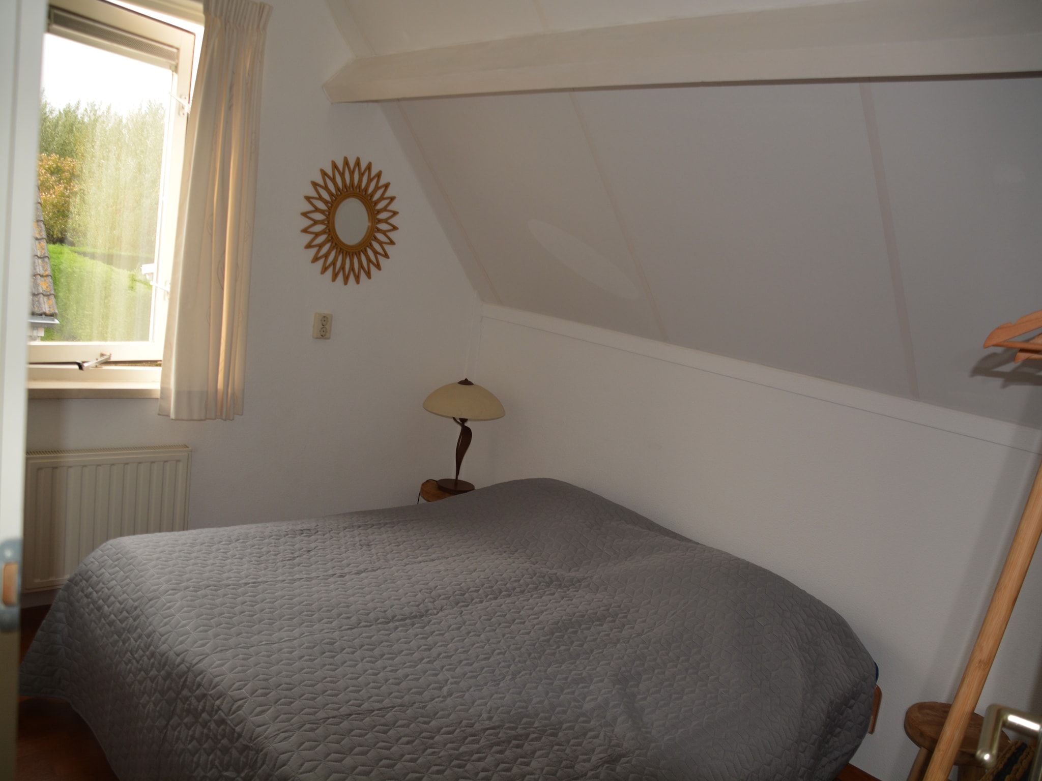 Een slaapkamer van Villapark De Oesterbaai 110 in Wemeldinge