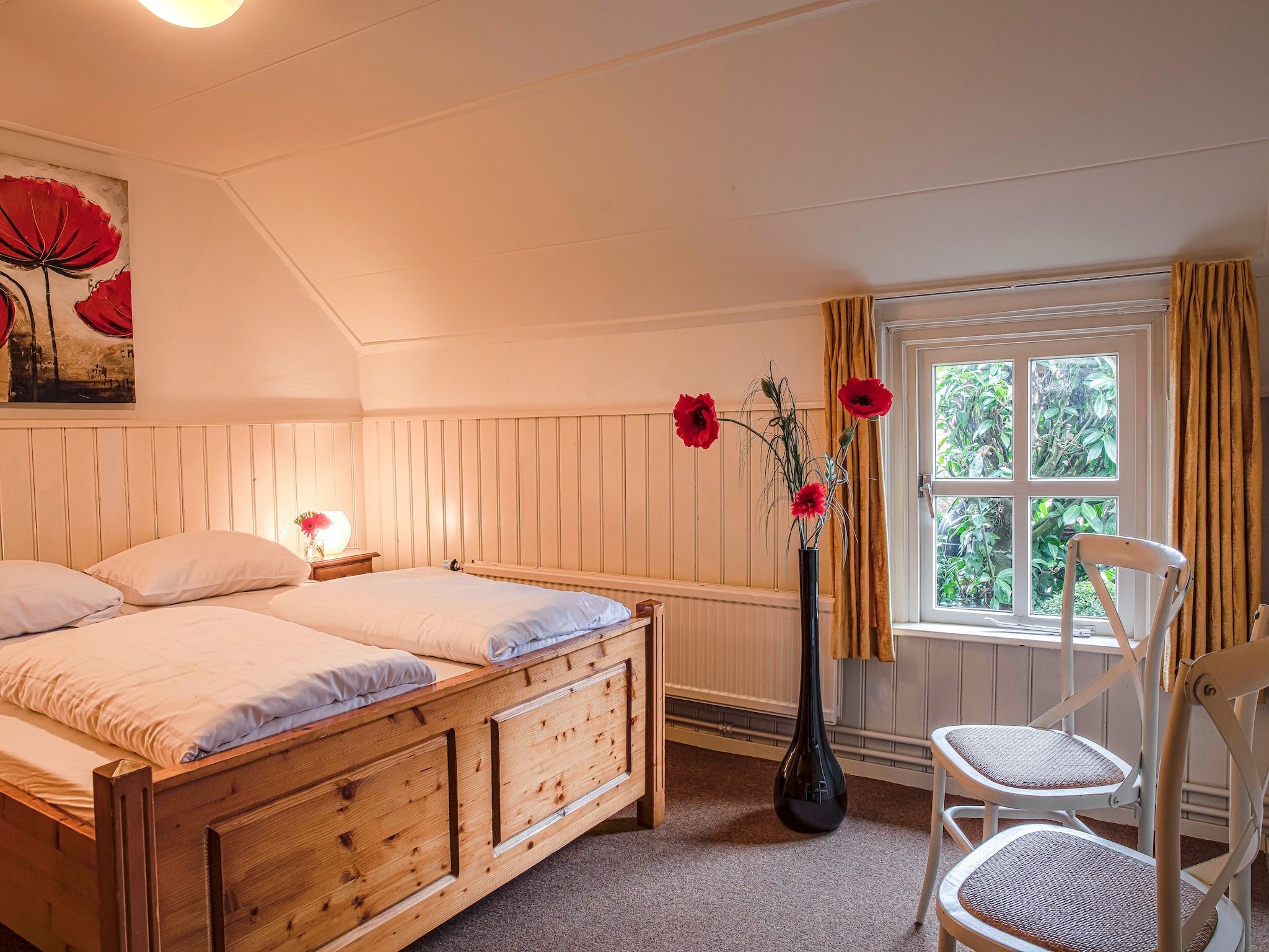 Een slaapkamer van De Familieboerderij in Losser