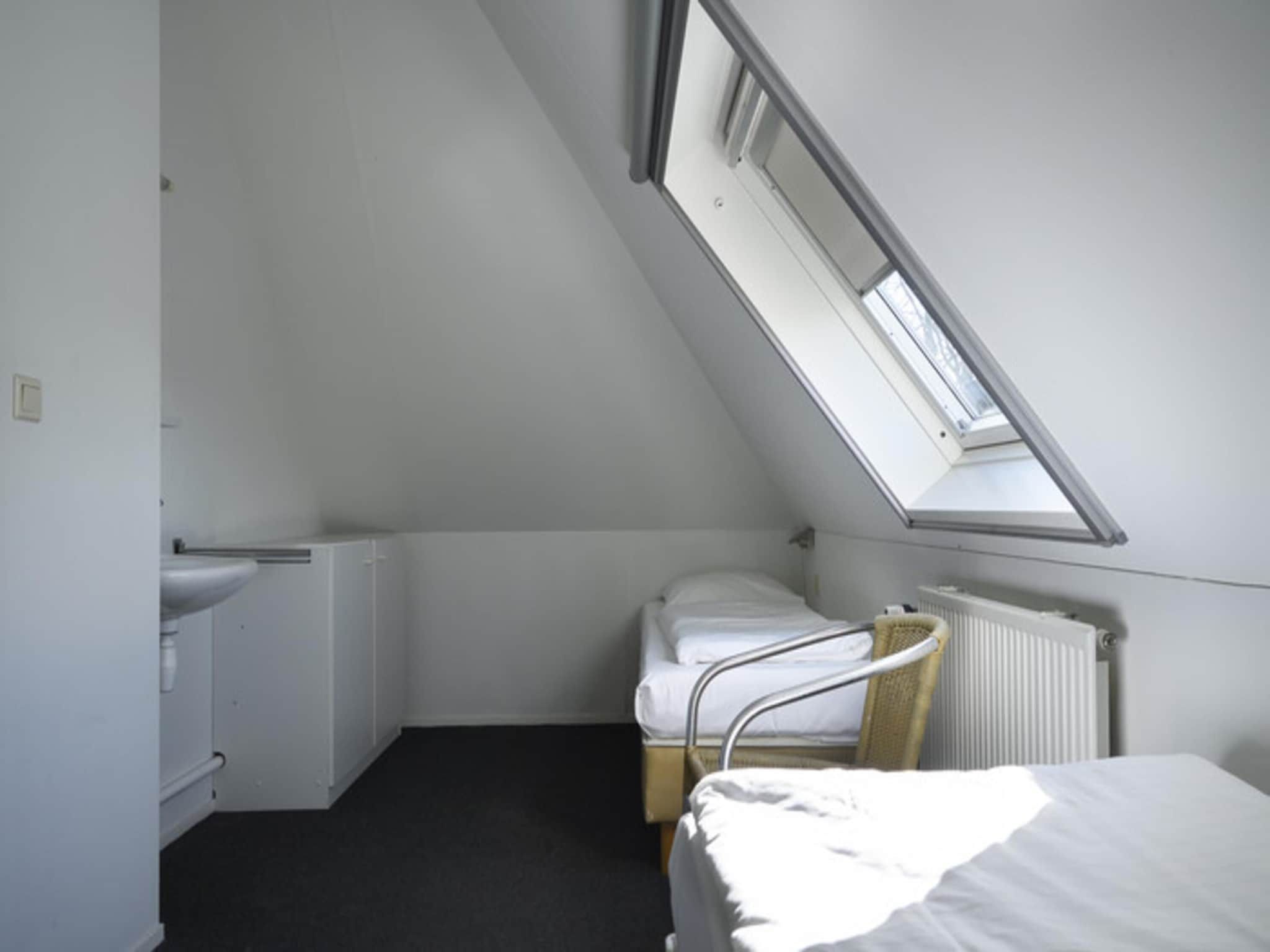 Een slaapkamer van Wiid Wellness de luxe met sauna & buitenspa in Friesland